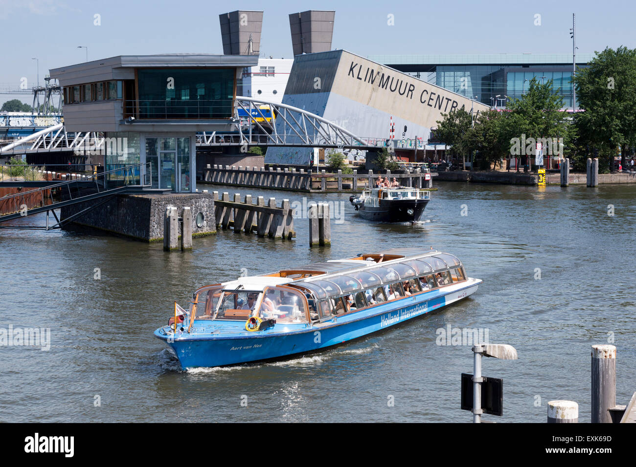 Tourist canal boat in Amsterdam, Klimmuur Centraal at the back, North Holland, The Netherlands Stock Photo