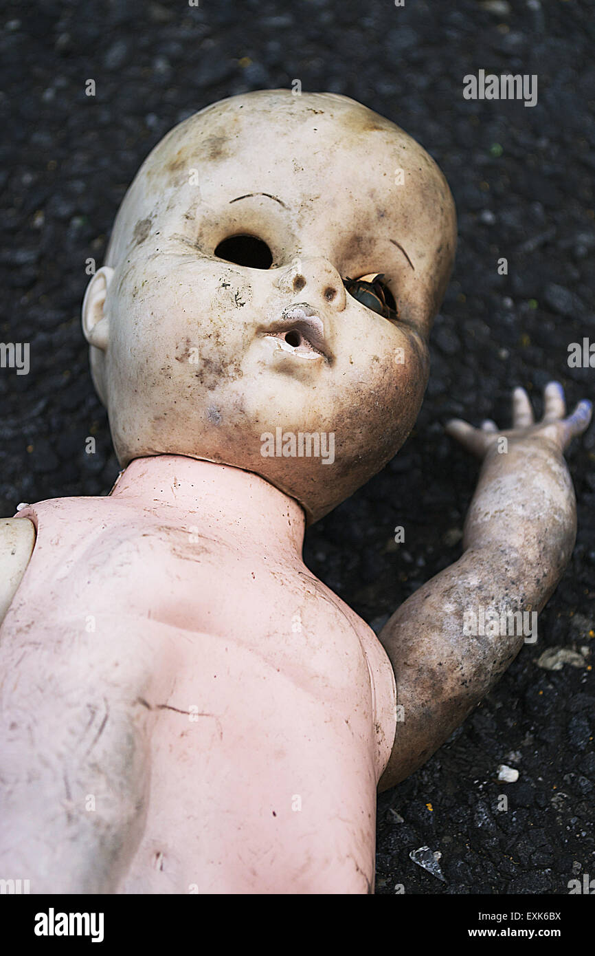 Scary Baby Doll On Street Stock Photo