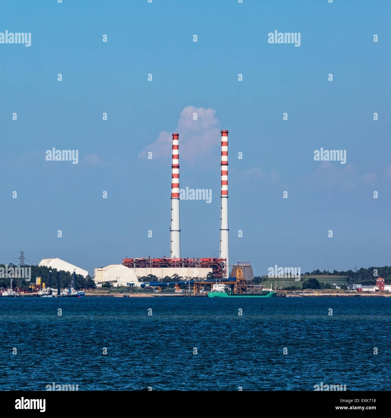 Electric Power Plant with Pipes, on blue sky background Stock Photo - Alamy