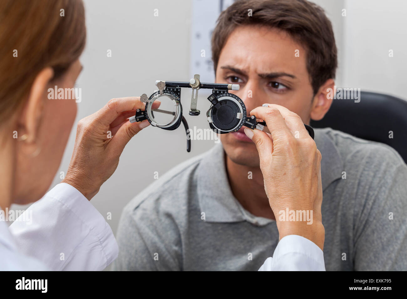 Man checking his eyes Stock Photo