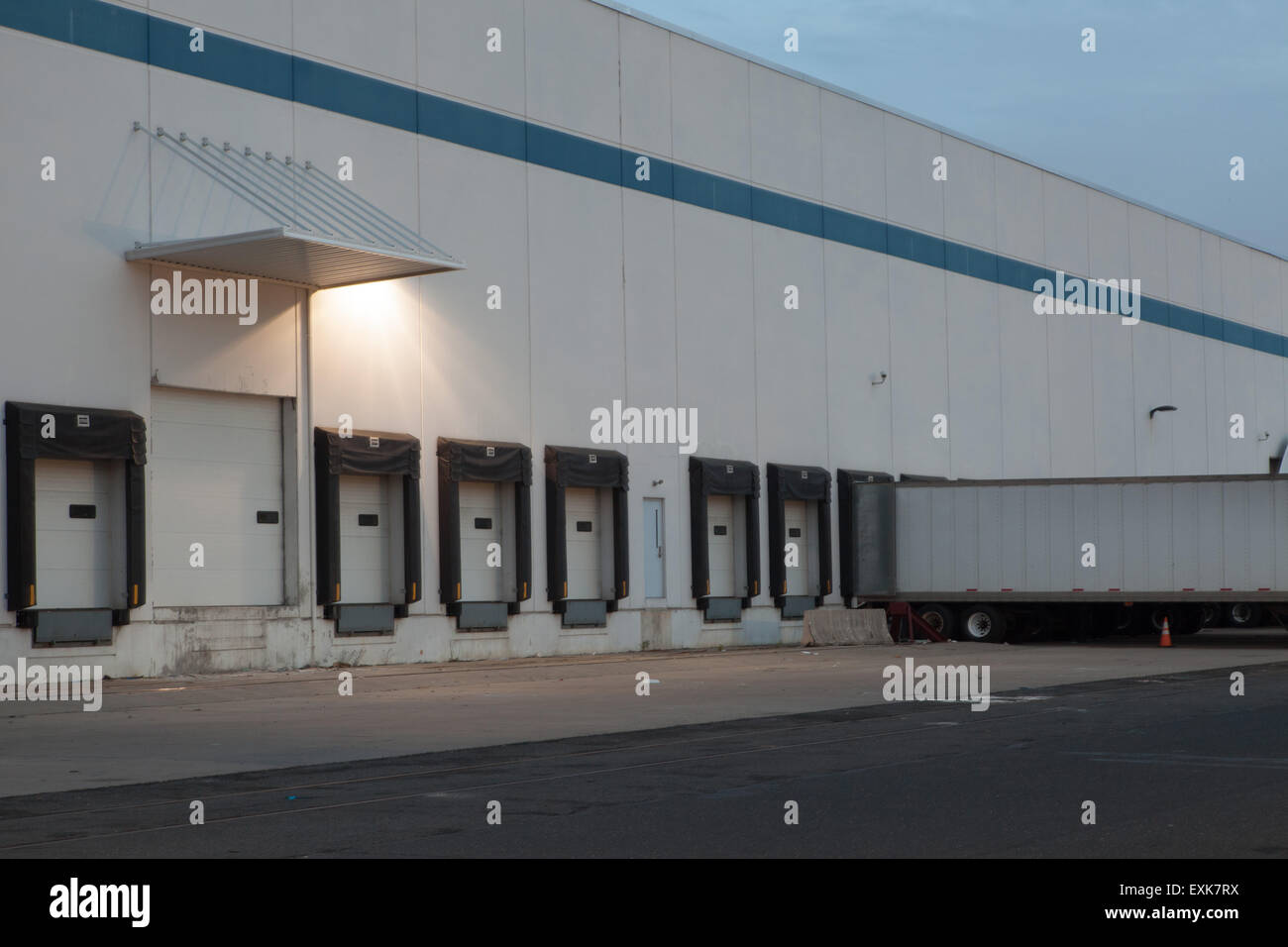 trucking loading docks at night with trailer Stock Photo