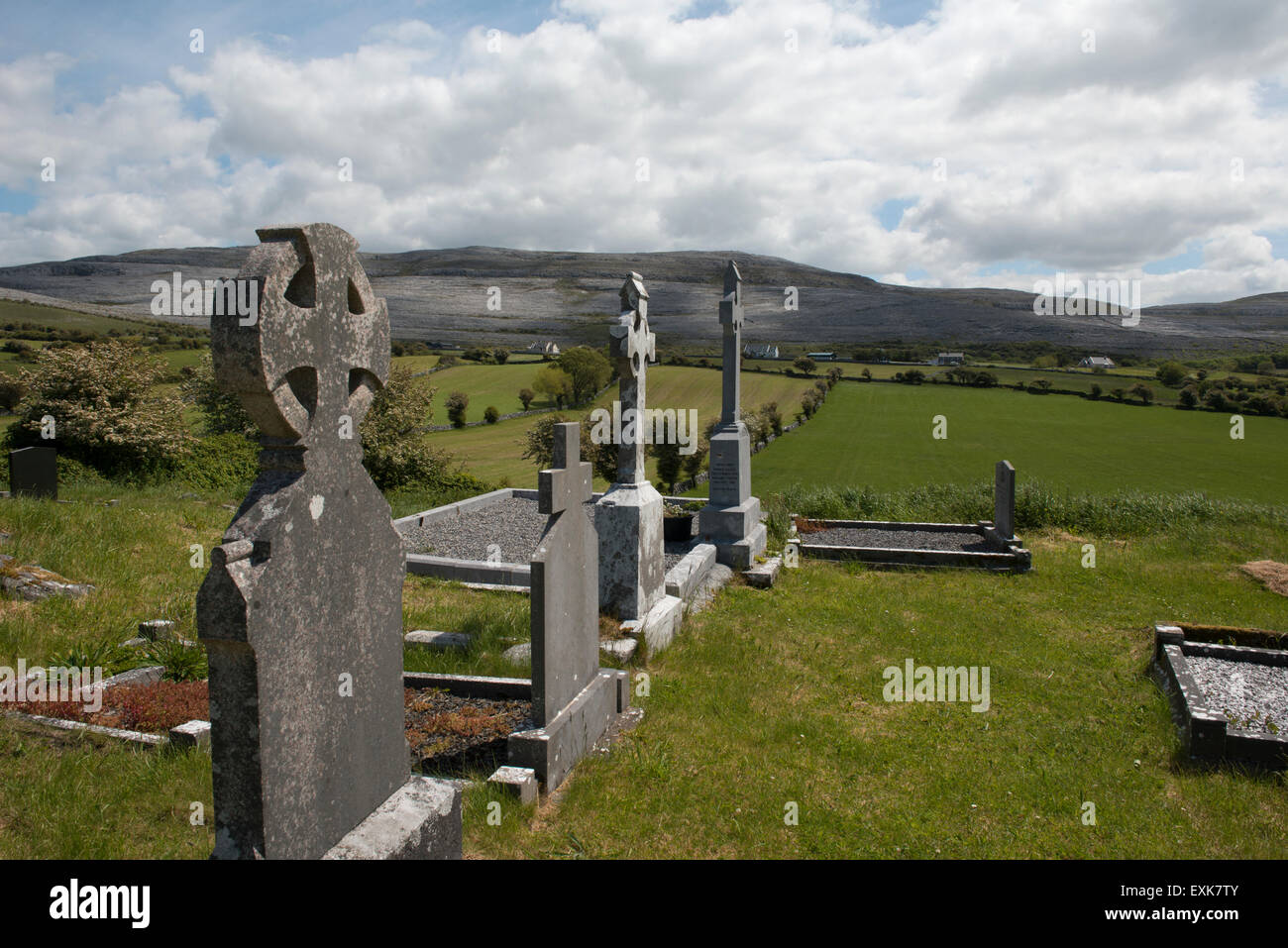 Cemetery in West Ireland with the Burren National Park in the background. Stock Photo