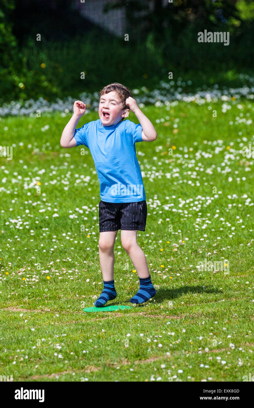 A young boy, 4, celebrating his win at pre-school sports day Stock Photo