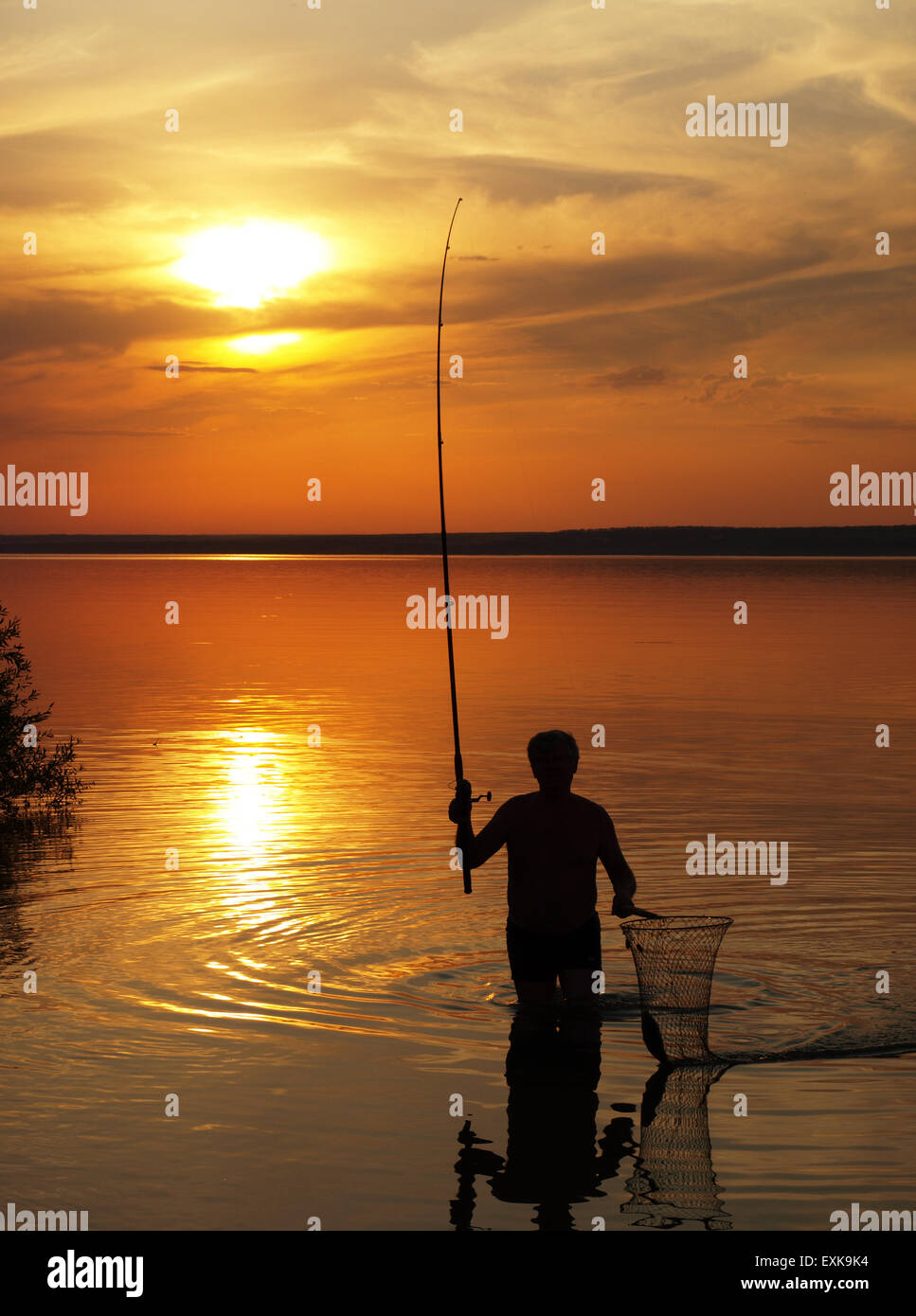 Fisherman catches a fish hi-res stock photography and images - Alamy