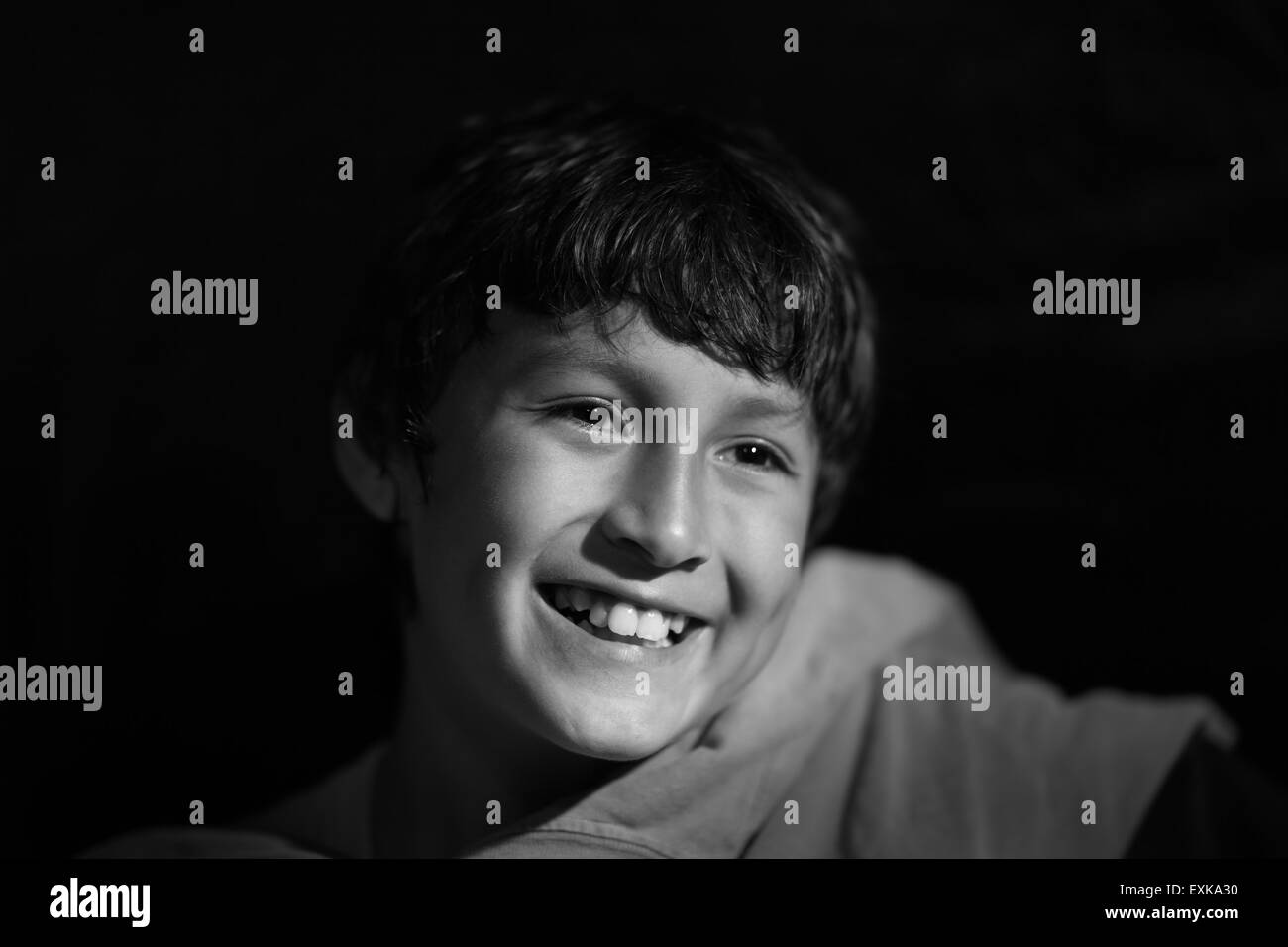 Young boy shot in monochrome vintage Hollywood lighting with shallow depth of field Stock Photo