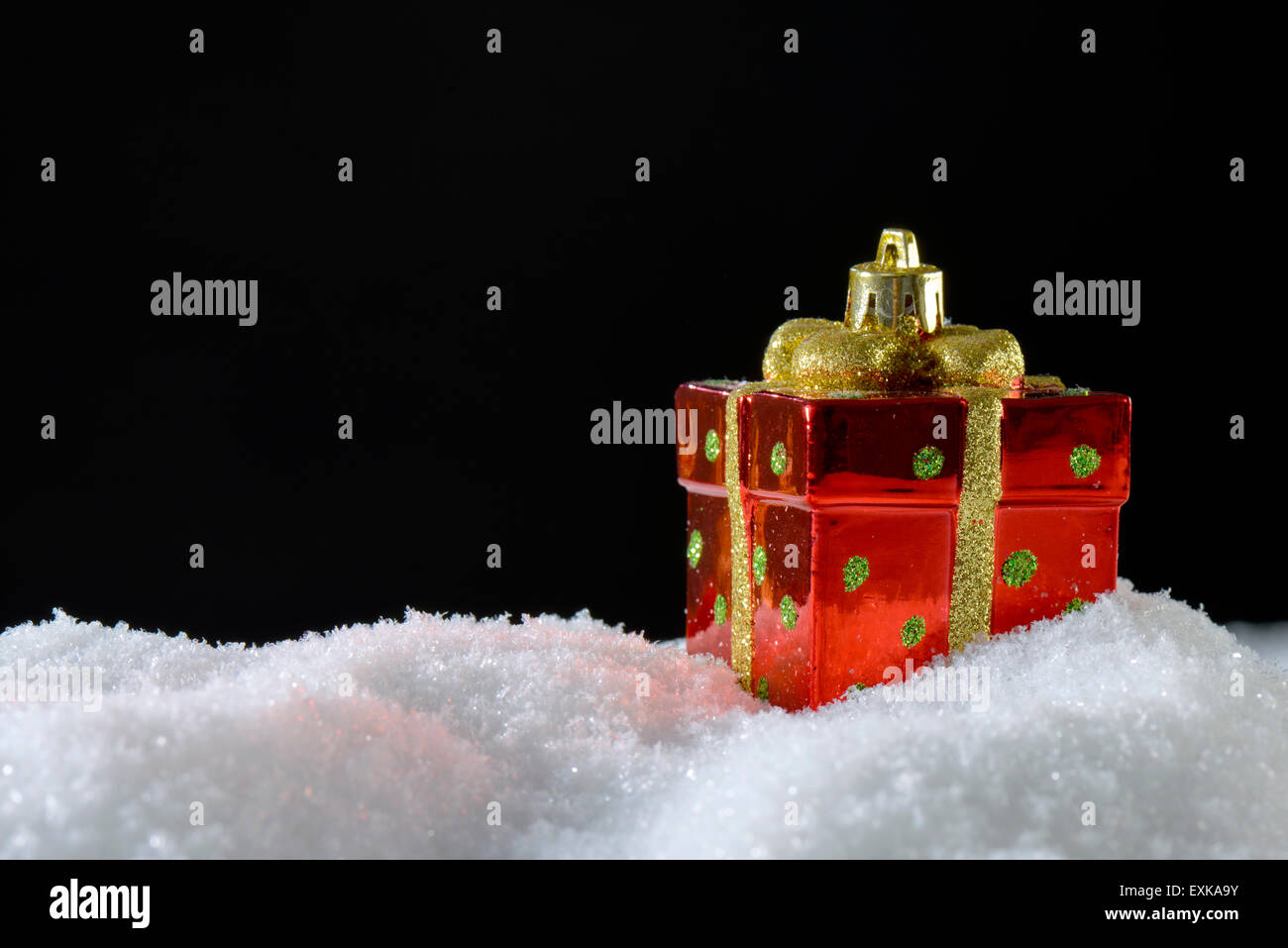 Christmas decoration Present on snow Stock Photo