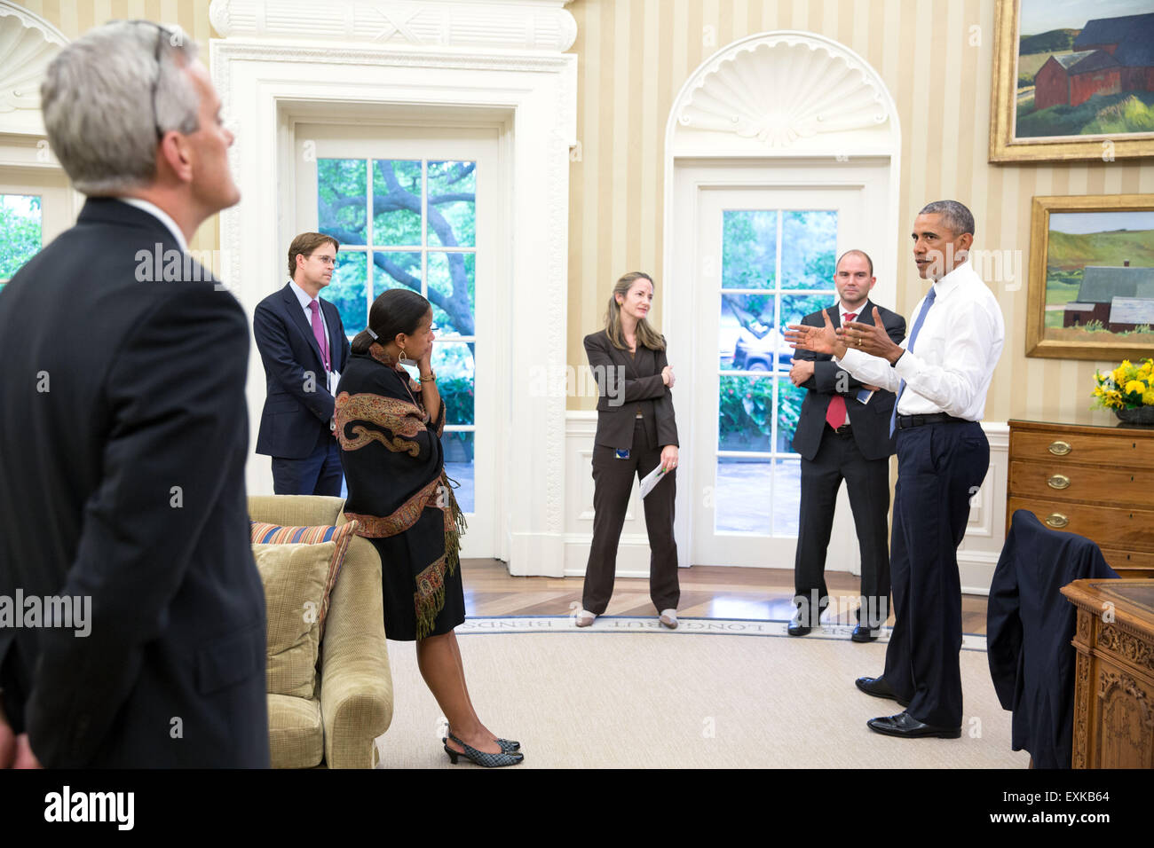 Washington, DC, USA. 14th July, 2015. U.S. President Barack Obama discusses the Iran nuclear agreement, with from left, Chief of Staff Denis McDonough, Jeffrey Prescott, Senior Director for Iran, Iraq, Syria, and the Gulf States, National Security Advisor Susan E. Rice, Avril Haines, Deputy National Security Advisor Counterterrorism and Ben Rhodes, Deputy National Security Advisor for Strategic Communications, in the Oval Office of the White House July 13, 2015 in Washington, DC. Stock Photo