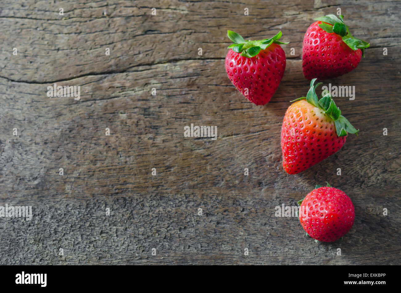 still life fresh strawberries over wooden background Stock Photo - Alamy