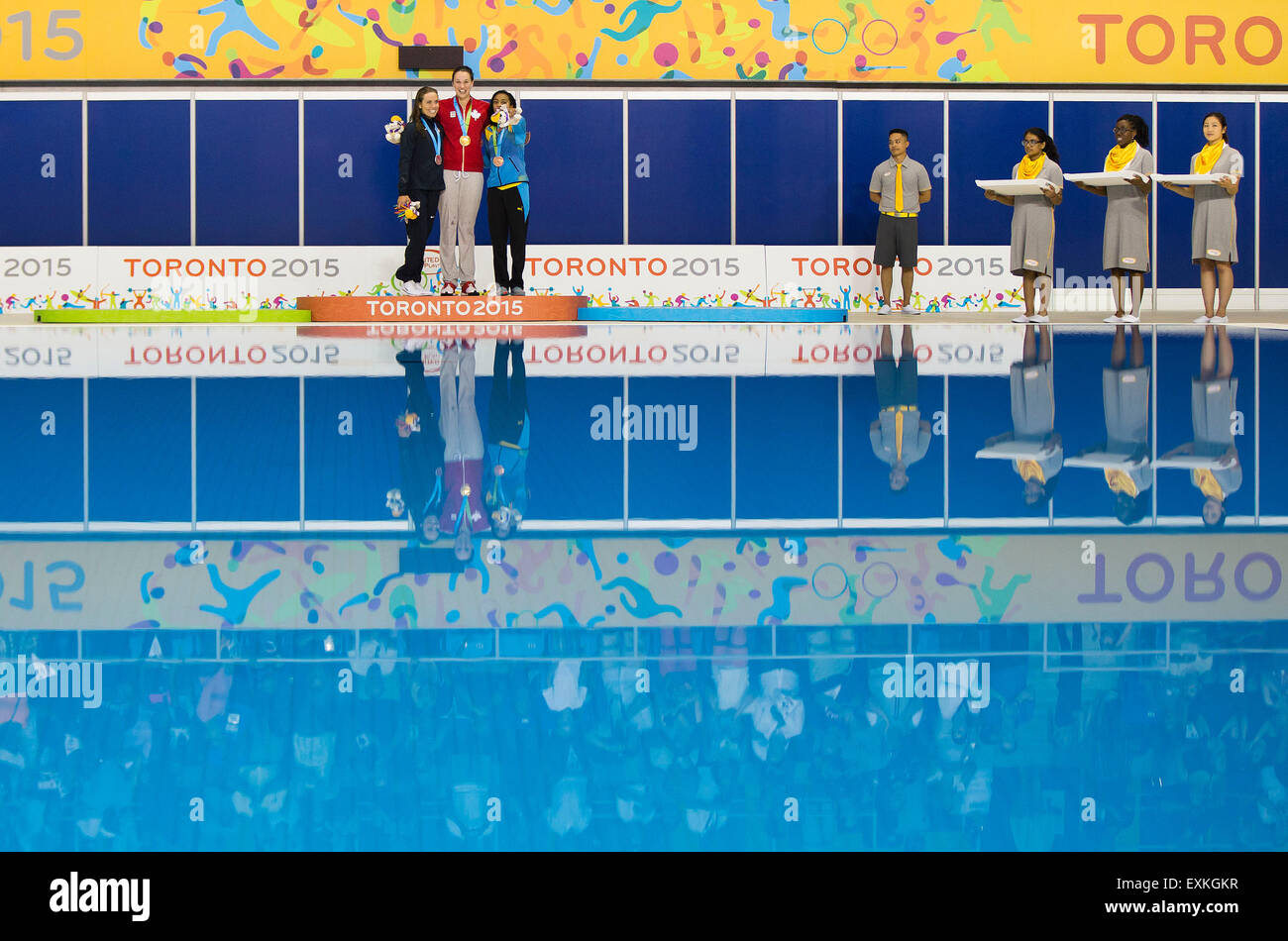 Toronto, Canada. 14th July, 2015. Medalists Natalie Coughlin (1st L) of the United States, Chantal Van Landeghem (2nd L) of Canada and Arianna Vanderpool-Wallace (3rd L) of the Bahamas pose for photos during the awarding ceremony of women's 100m freestyle final of swimming event at the 17th Pan American Games in Toronto, Canada, July 14, 2015. Chantal Van Landeghem won the gold medal with 53.83 seconds. © Zou Zheng/Xinhua/Alamy Live News Stock Photo