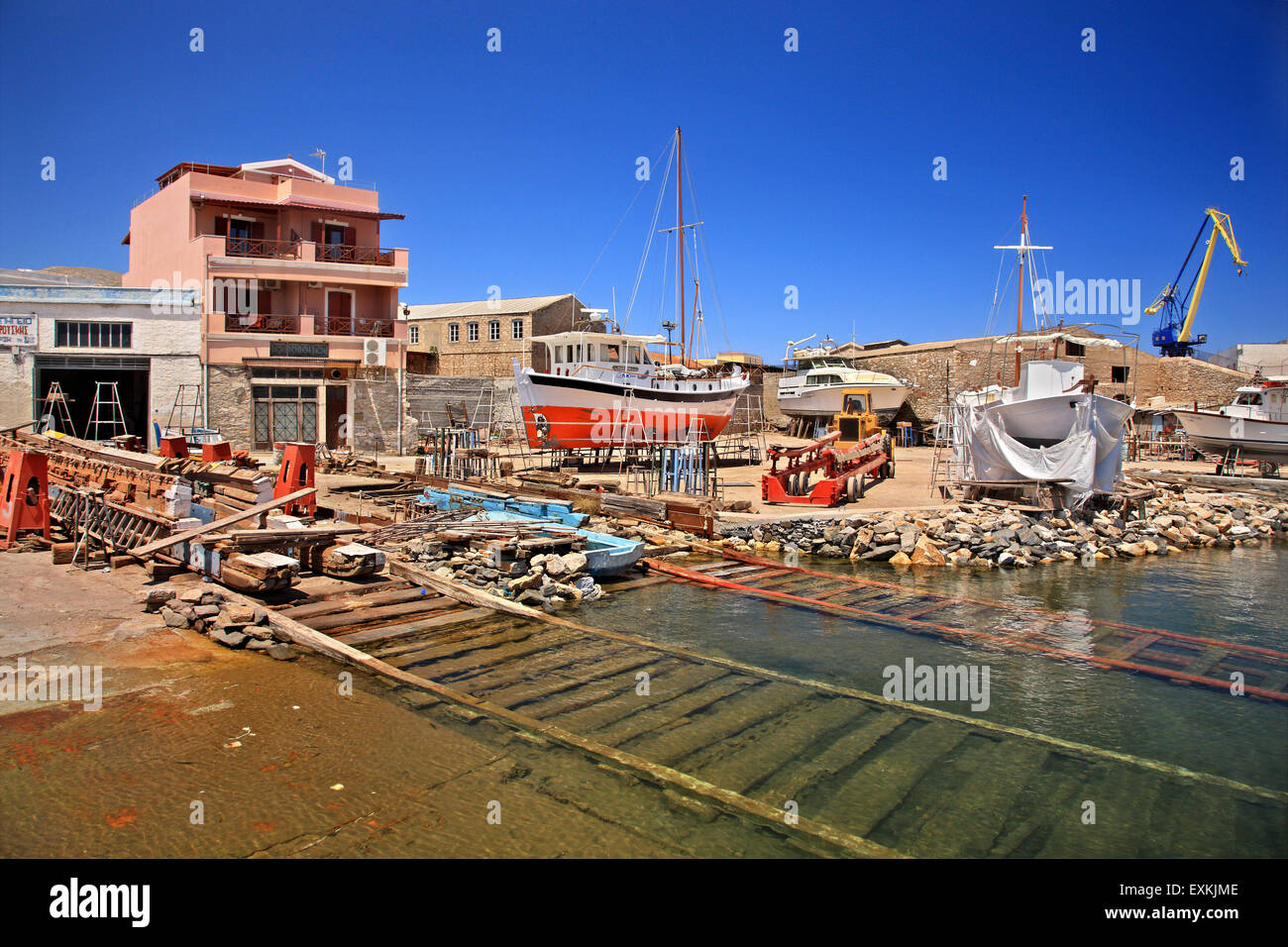 Traditional shipyard (called 'Tarsanas' or 'Karnagio') Ermoupolis town, Syros island, Cyclades, Greece. Stock Photo