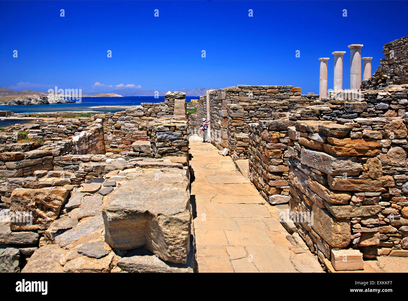 Walking around the ancient town in the archaeological site of the 'sacred' island of Delos. Cyclades, Greece. Stock Photo