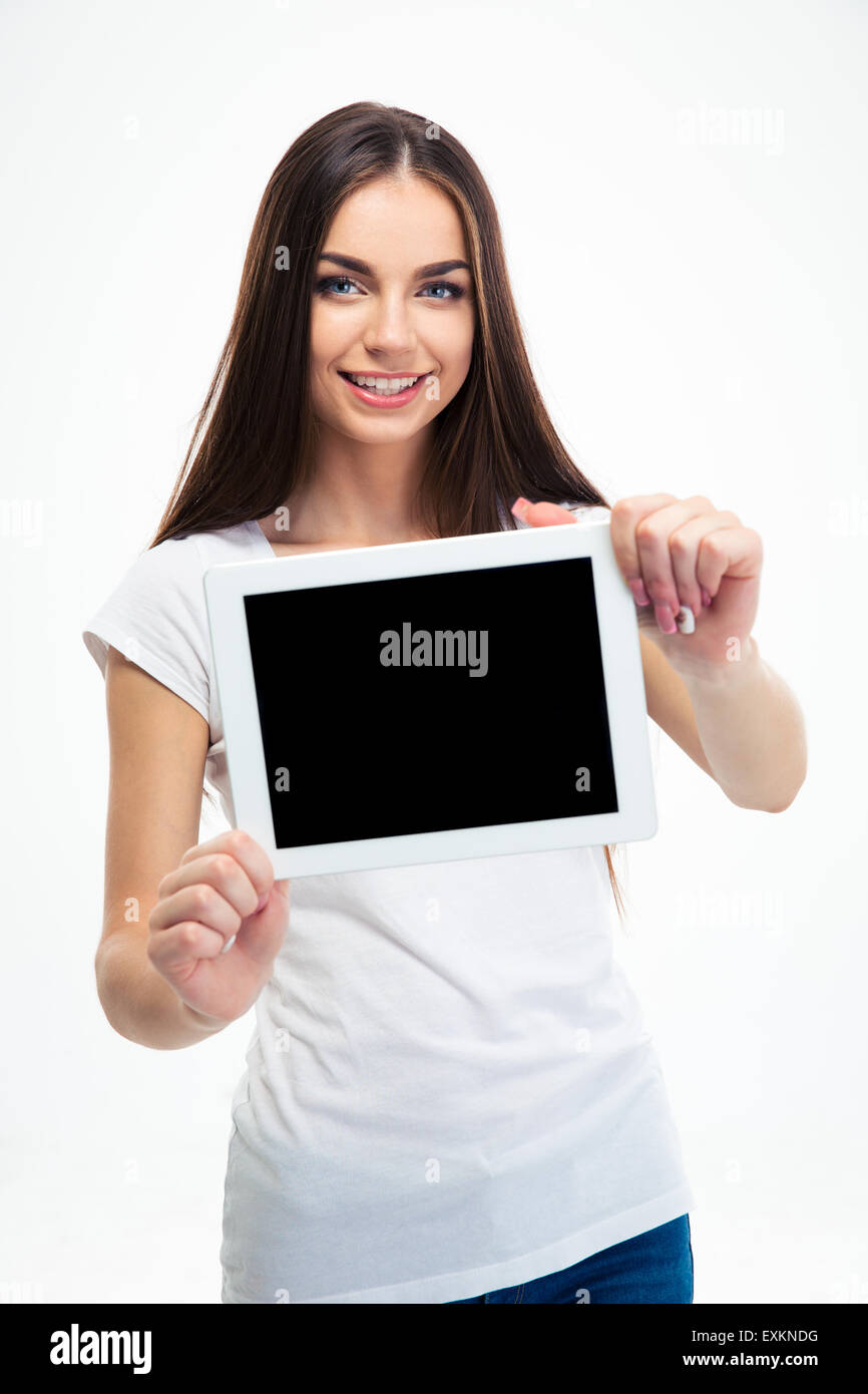 Smiling pretty woman showing blank tablet computer screen isolated on a ...