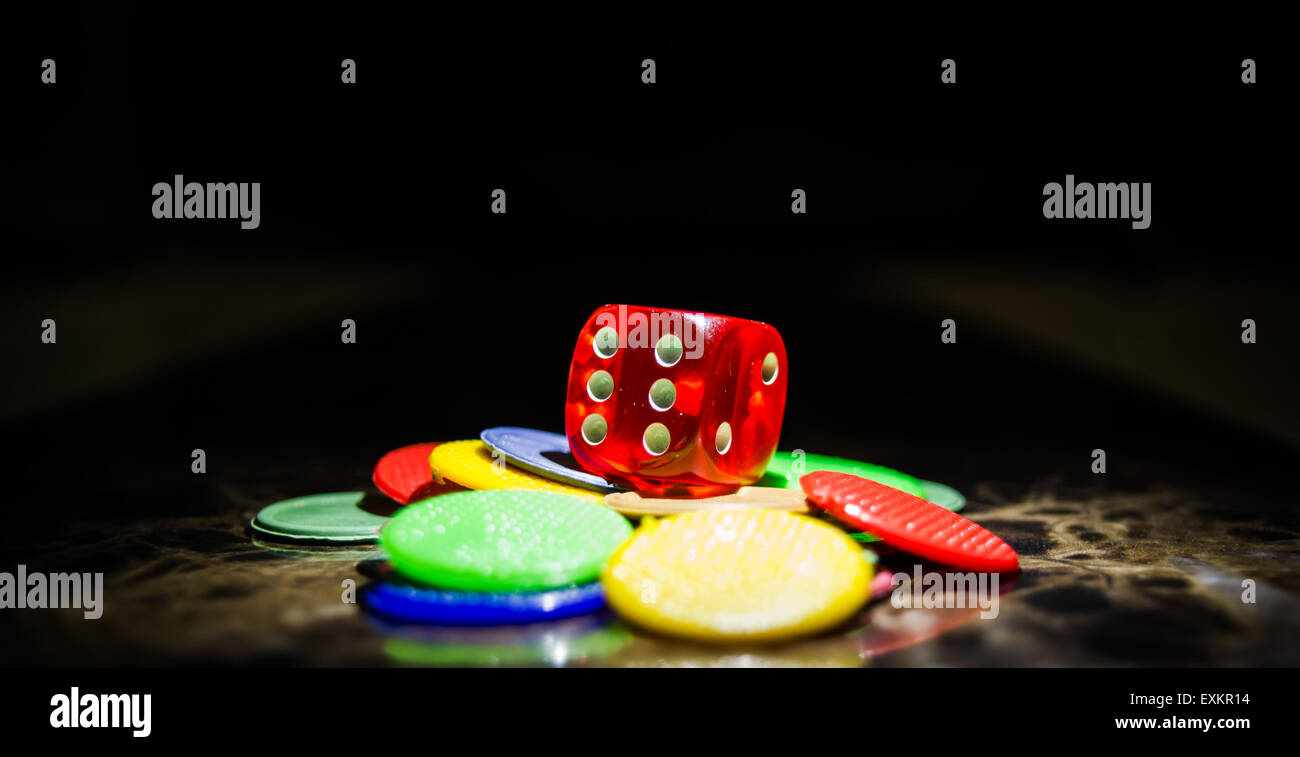 Casino Dice and tokens/chips used in playing various indoor board games