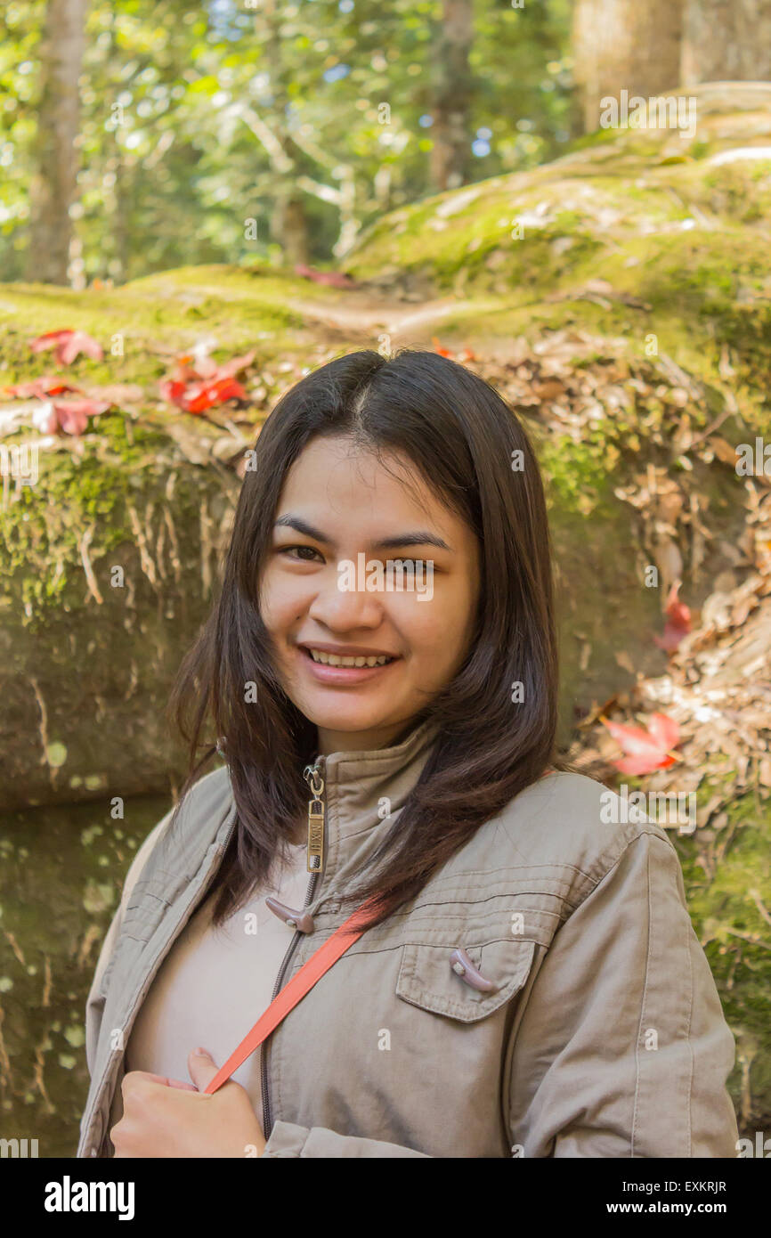 Asian girl smiling in the park Stock Photo - Alamy