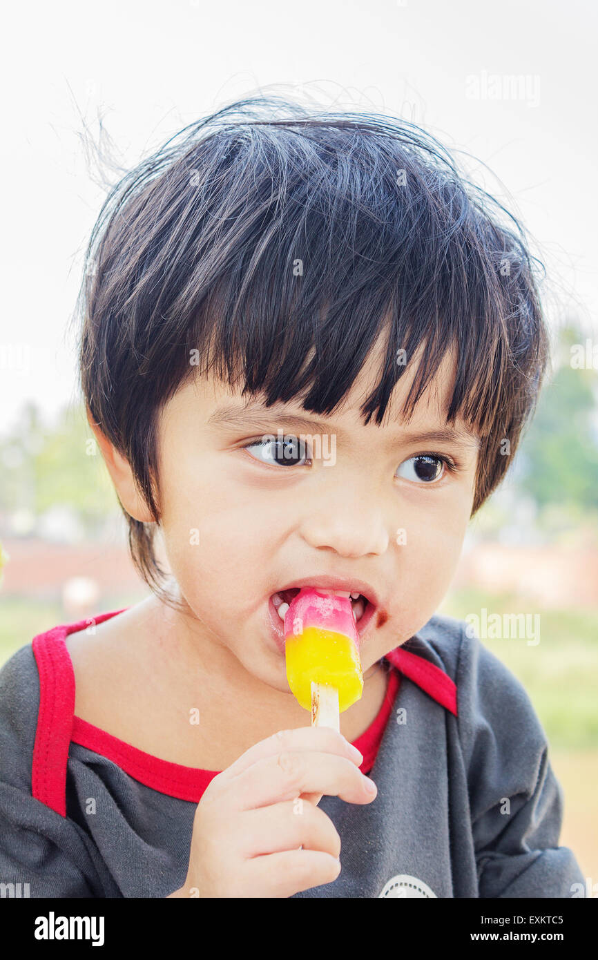 Portrait of Asian Thai little boy eating ice cream Stock Photo - Alamy