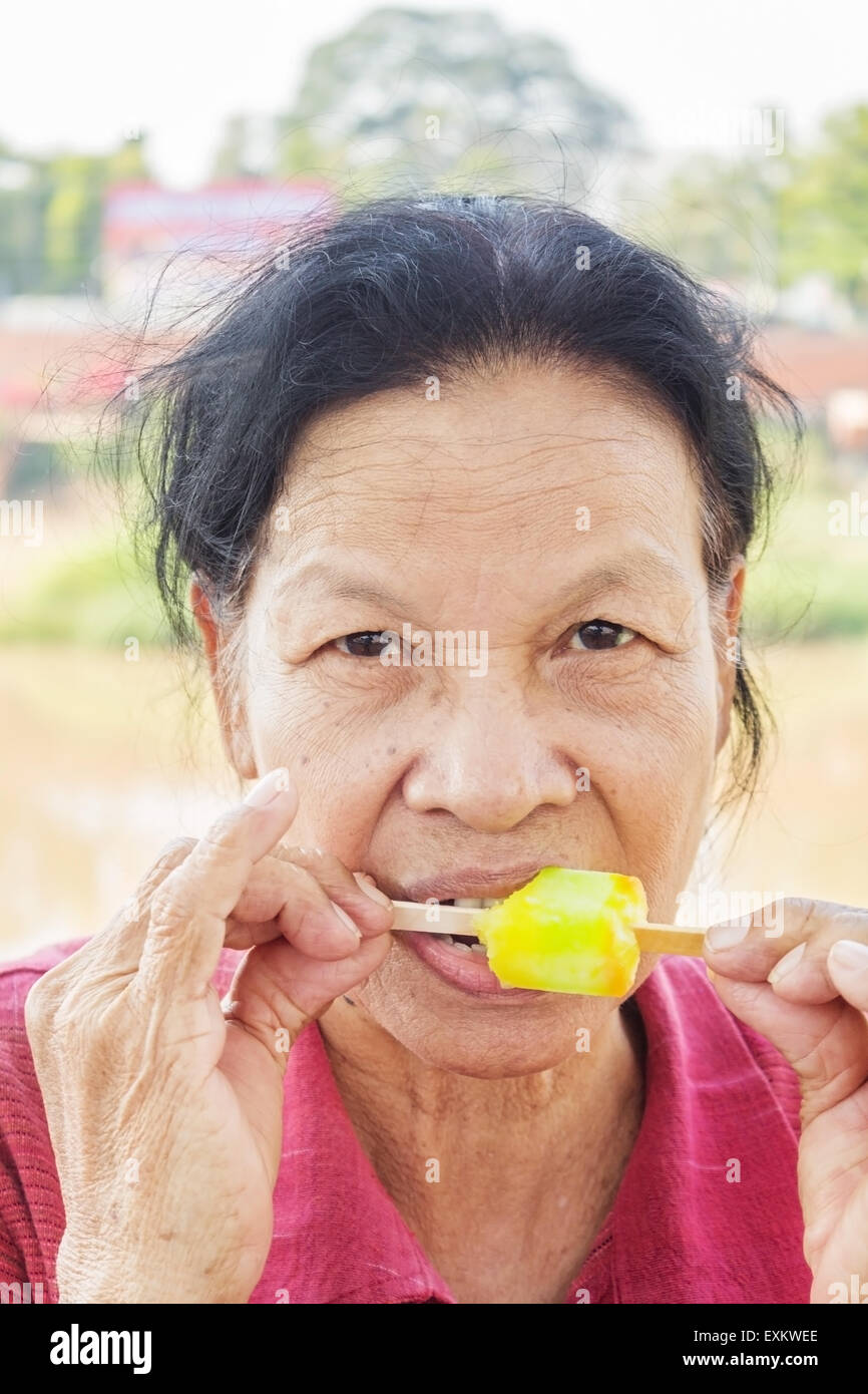 Old woman eating ice cream hires stock photography and images Alamy