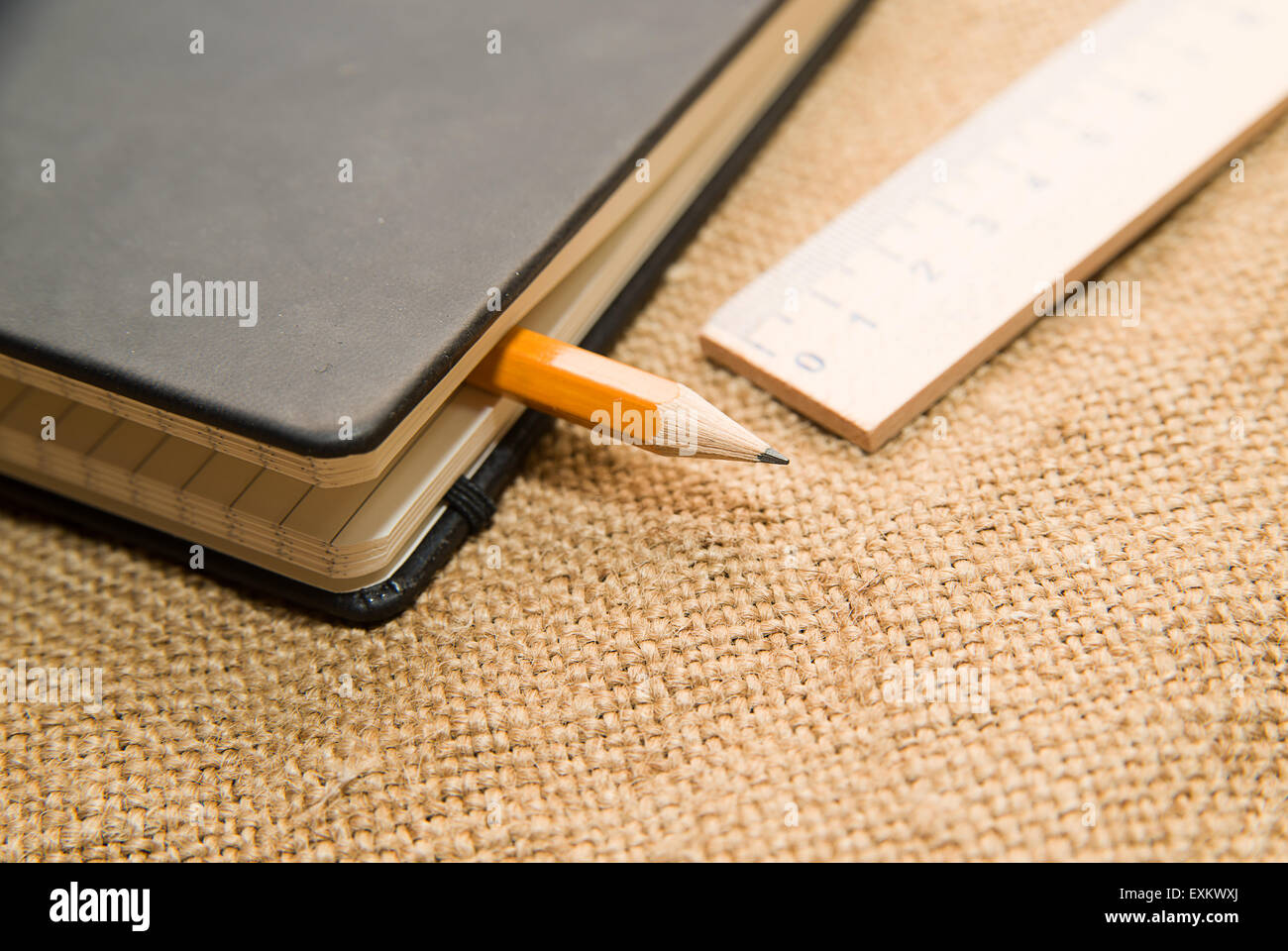 Notepad with a recording sheet, pencil and wooden ruler on the old ...