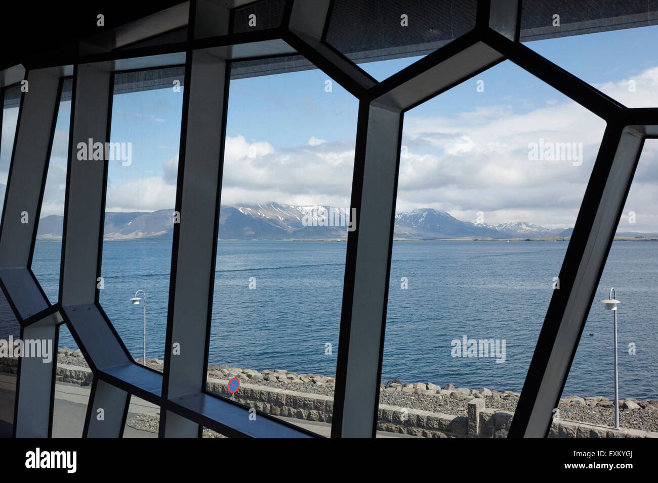 looking out through the windows of the Harpa concert hall and conference centre Reykjavik iceland Stock Photo