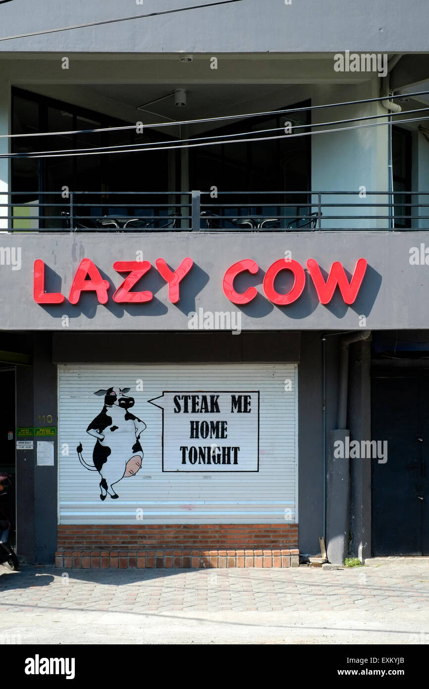 the unusually named lazy cow restaurant in solo java indonesia Stock Photo