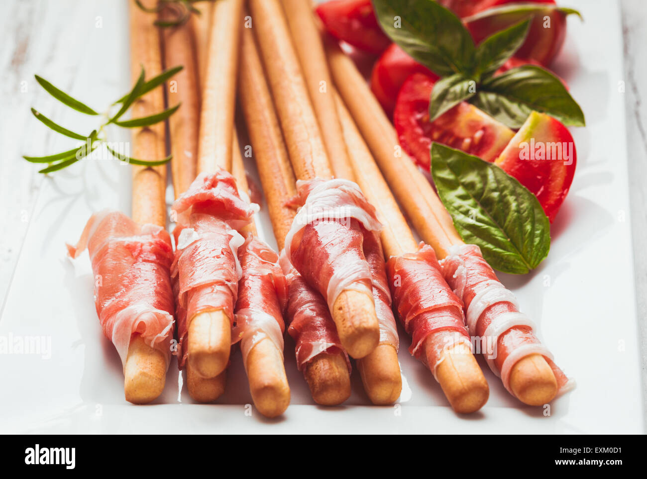 Grissini with prosciutto Stock Photo Alamy