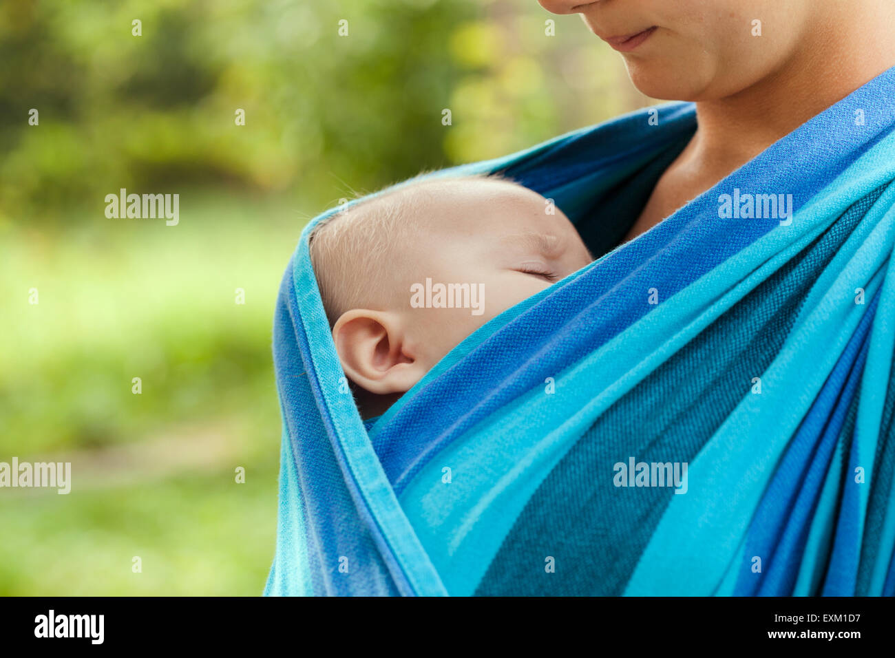 Baby in sling Stock Photo Alamy