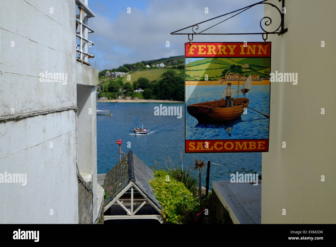 Salcombe, Devon, UK. The Ferry Inn Pub sign with the Ferry approaching the Salcombe Landing in the background Stock Photo