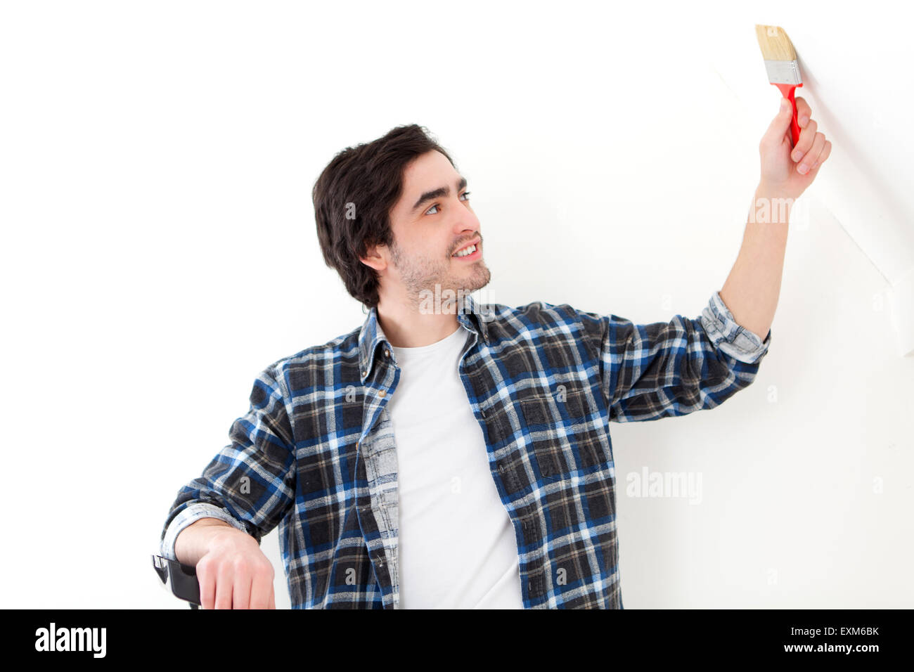 Man with paint brush hi-res stock photography and images - Alamy