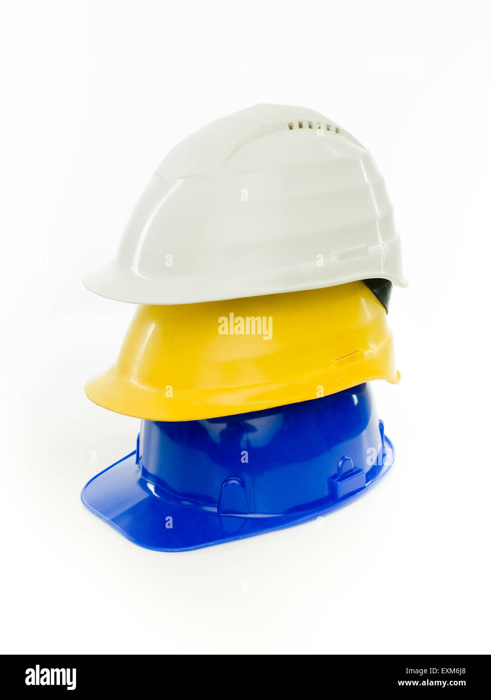 stack of multi colored hardhats isolated on white background Stock ...