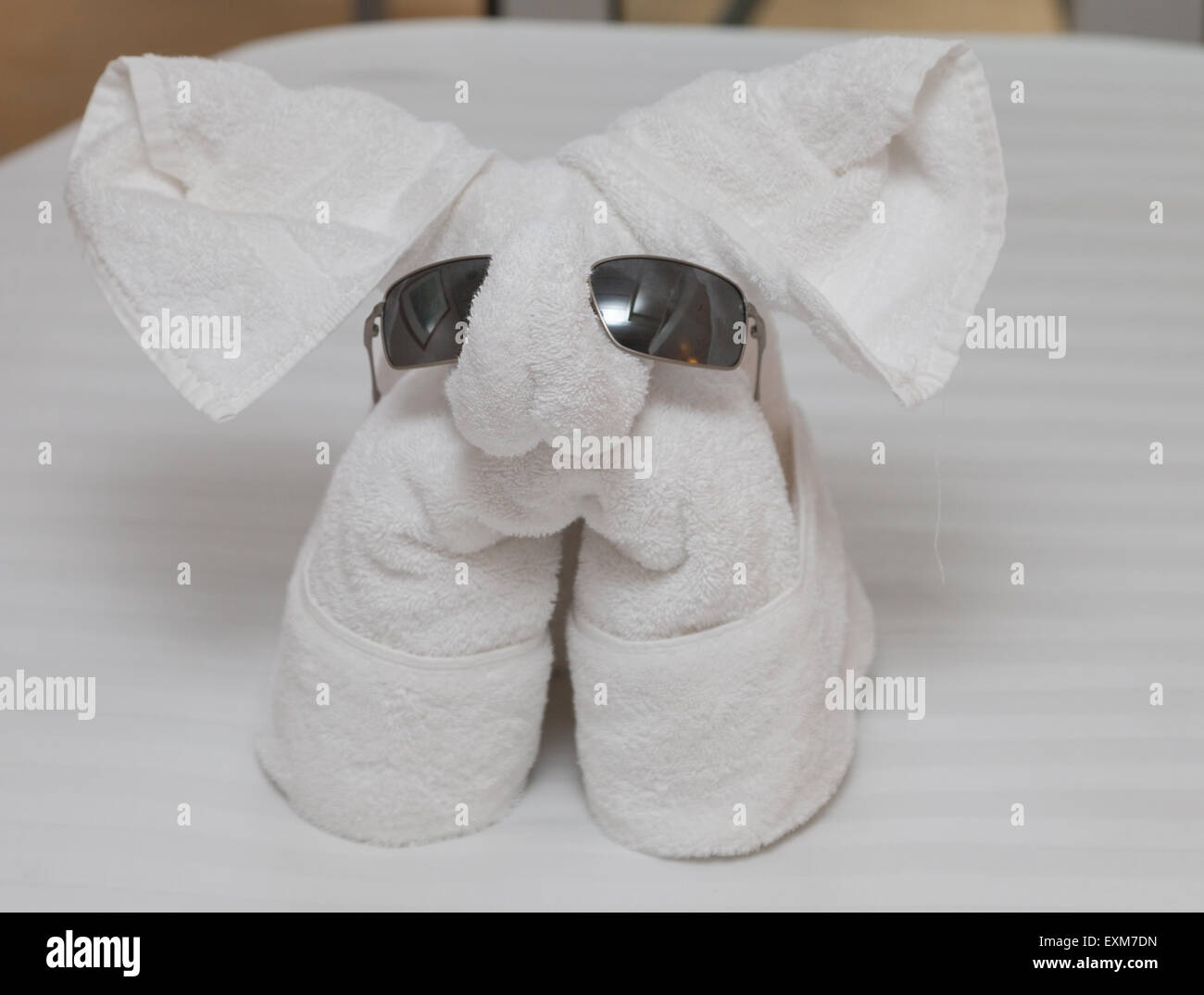 Towel elephant with sunglasses on Stock Photo