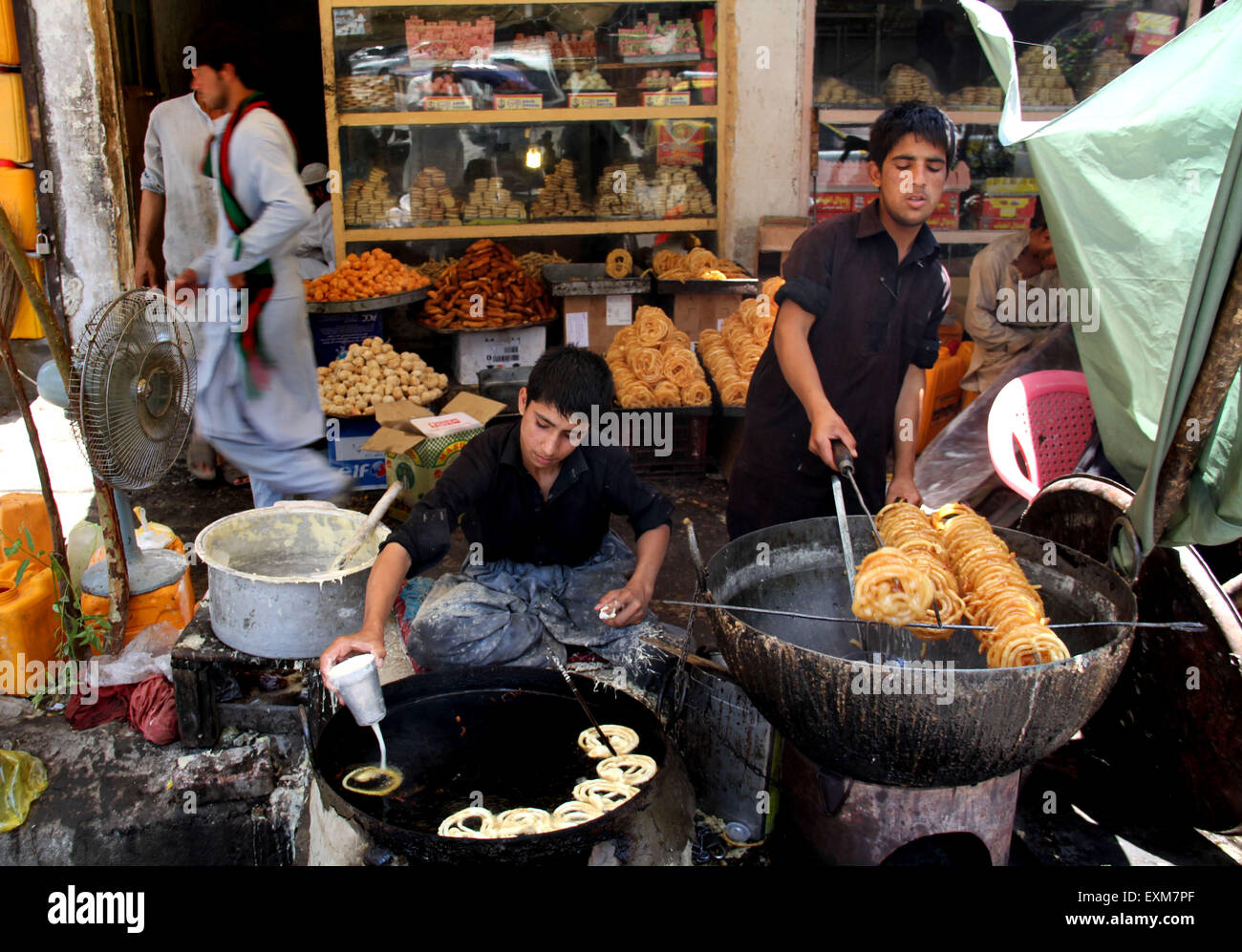 Nangarhar, Afghanistan. 15th July, 2015. Afghan men make traditional