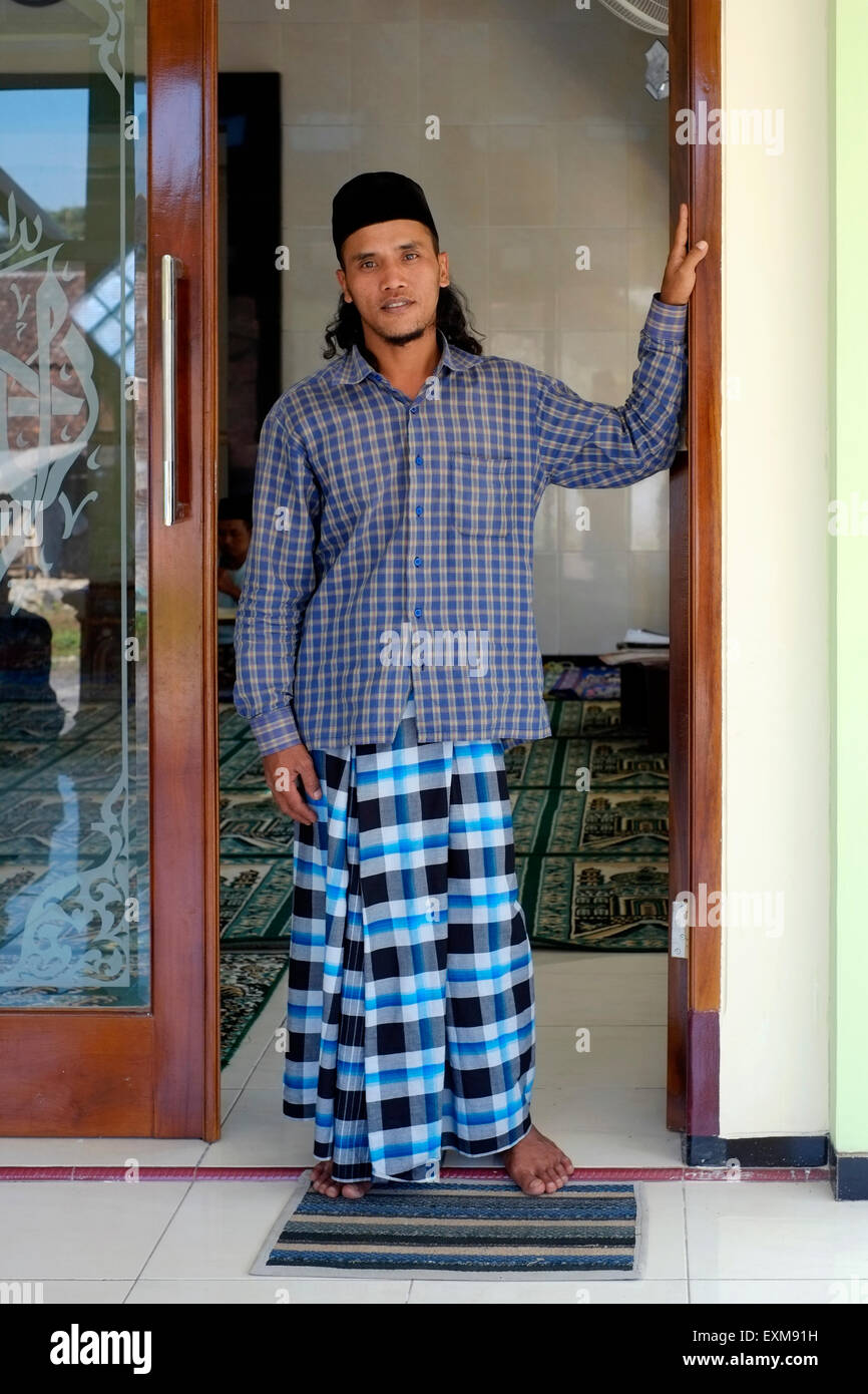 local man standing at the entrance at a small village mosque during ...