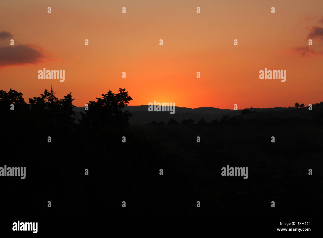 Sunset over the mountains Stock Photo - Alamy