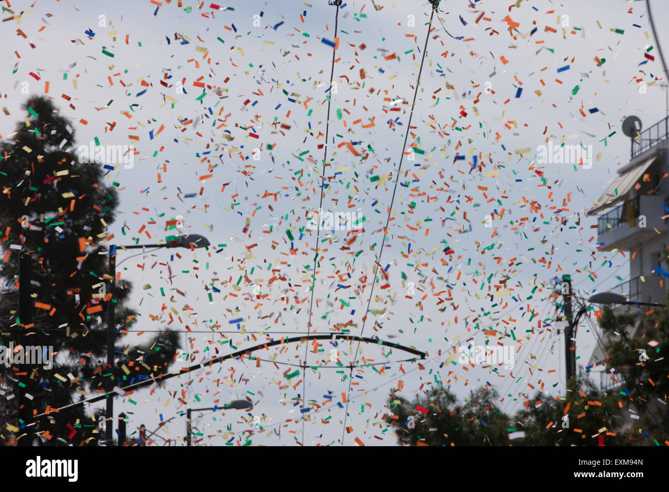 Athenian sky full of confetti explosions during the Agios Ioannis annual  carnival parade. Athens, Greece Stock Photo - Alamy