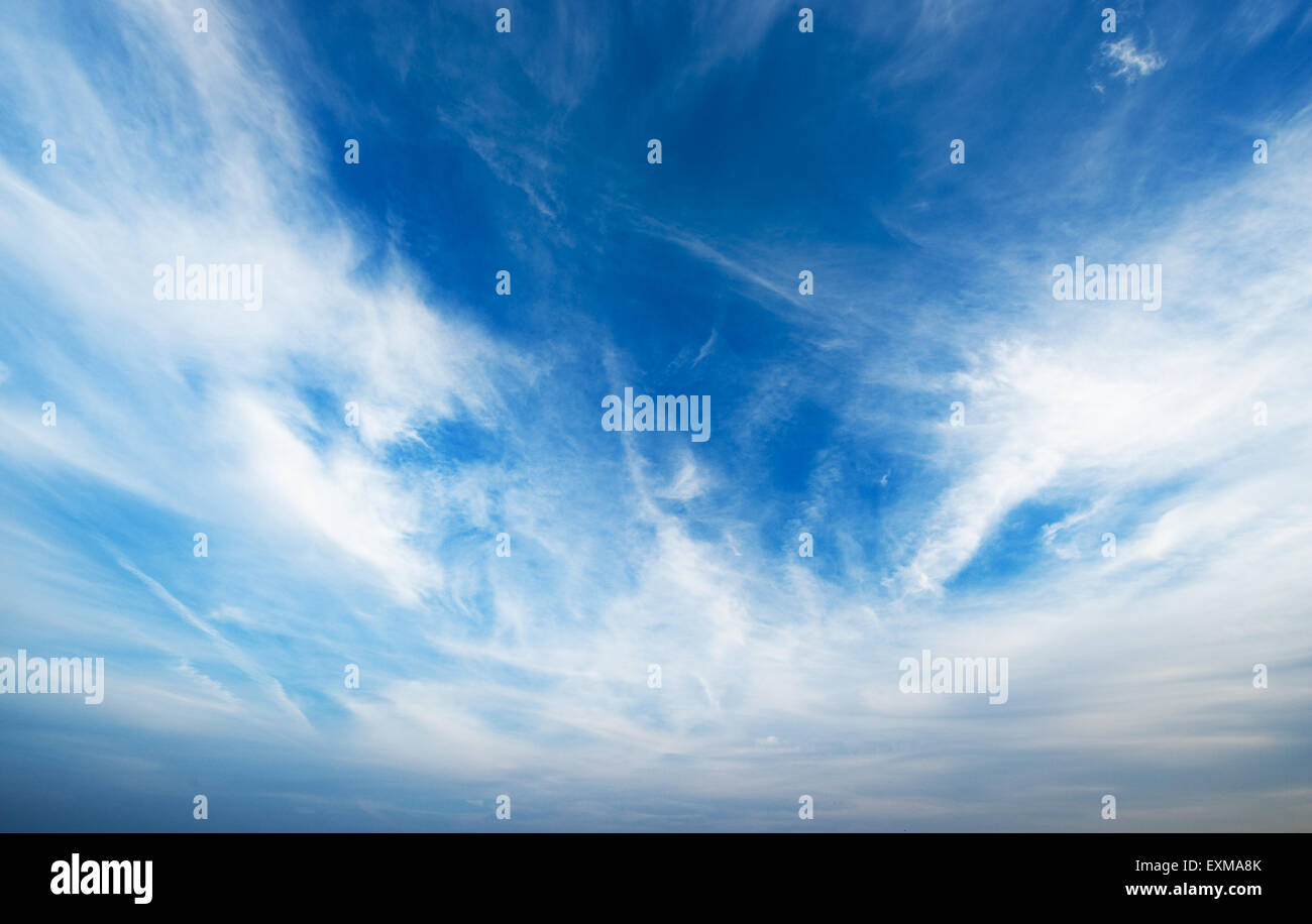 Blue sky with fluffy clouds Stock Photo - Alamy