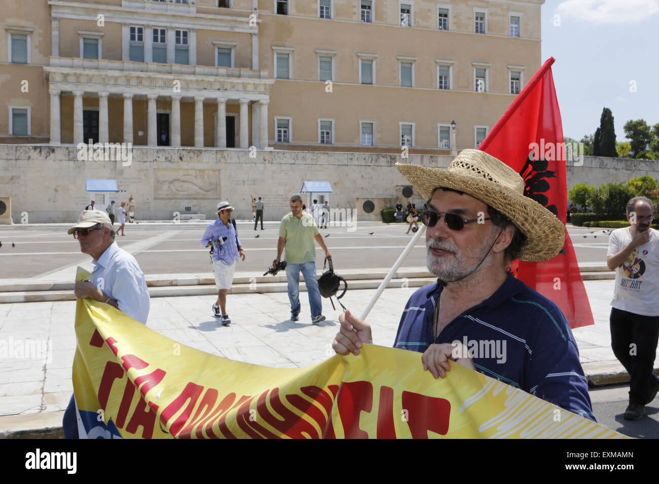 Athens, Greece. 15th July 2015. Protesters march past the Greek Parliament at the Union's anti-austerity protest. Greek Unions have called for a 24h strike on the day, the Greek Parliament is going to vote on the new austerity measures, the creditors of Greece have imposed as a precondition for the start of the discussion about the 3rd bailout program for Greece. Stock Photo