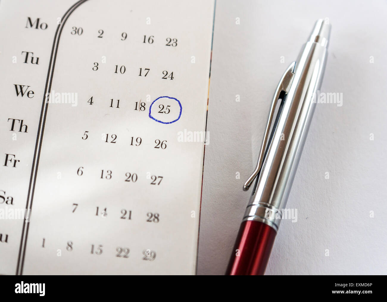 Important Date On Calendar and Pen Stock Photo