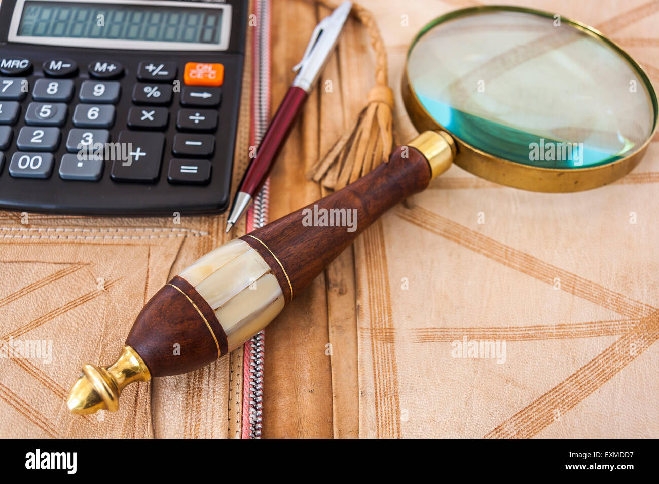 Calculator,Magnifying Glass And Pen,Lying On The Open Leather Folder ...