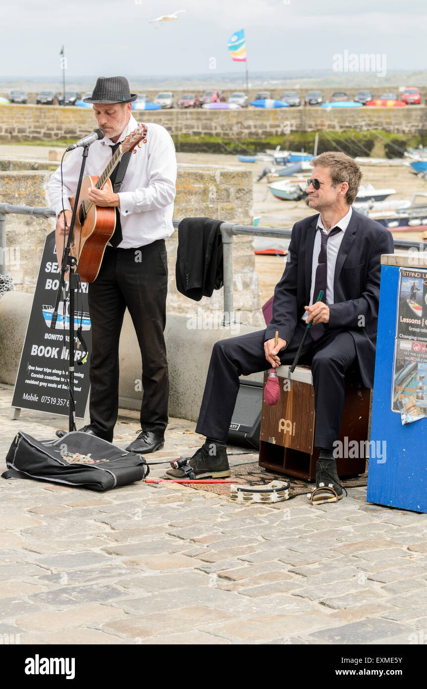 Buskers playing on The Wharf, St Ives, Cornwall, England, U.K. Stock Photo