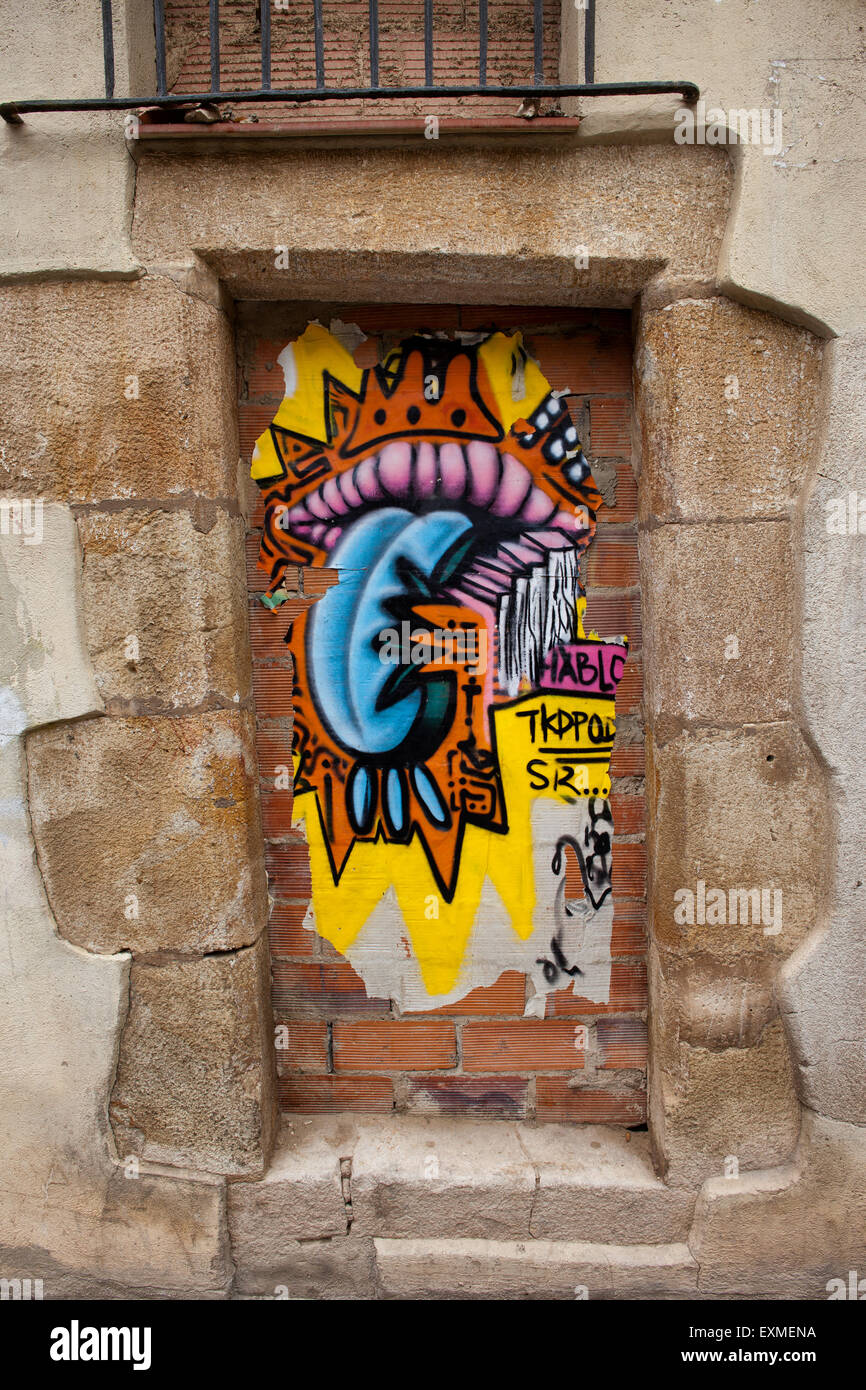 Mouth and tongue urban graffiti on a blind door in Barcelona, Spain. Stock Photo