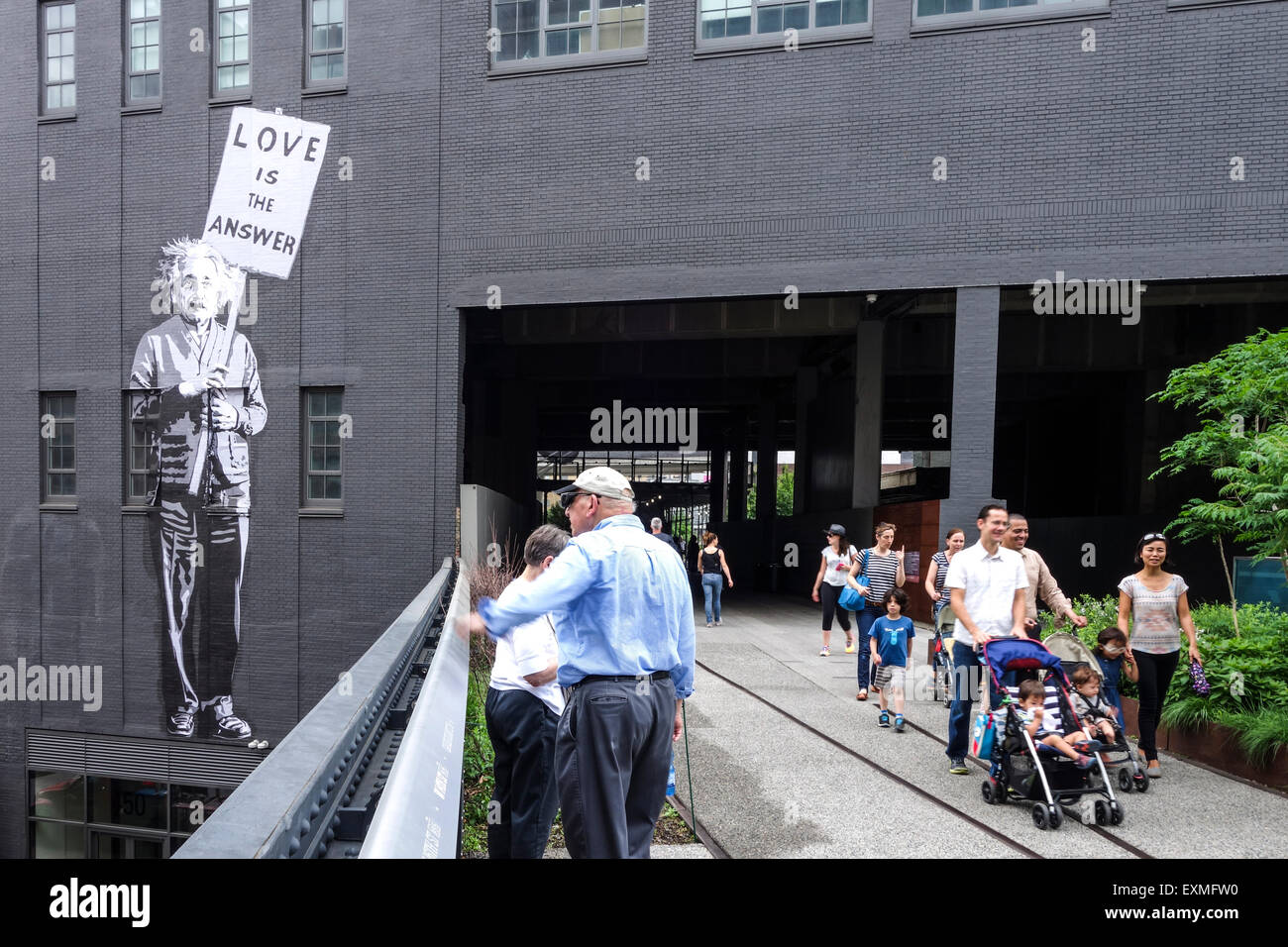 The New York City elevated High Line Park, former railroad, with street art, mural on wall, Manhattan, New York City, USA. Stock Photo