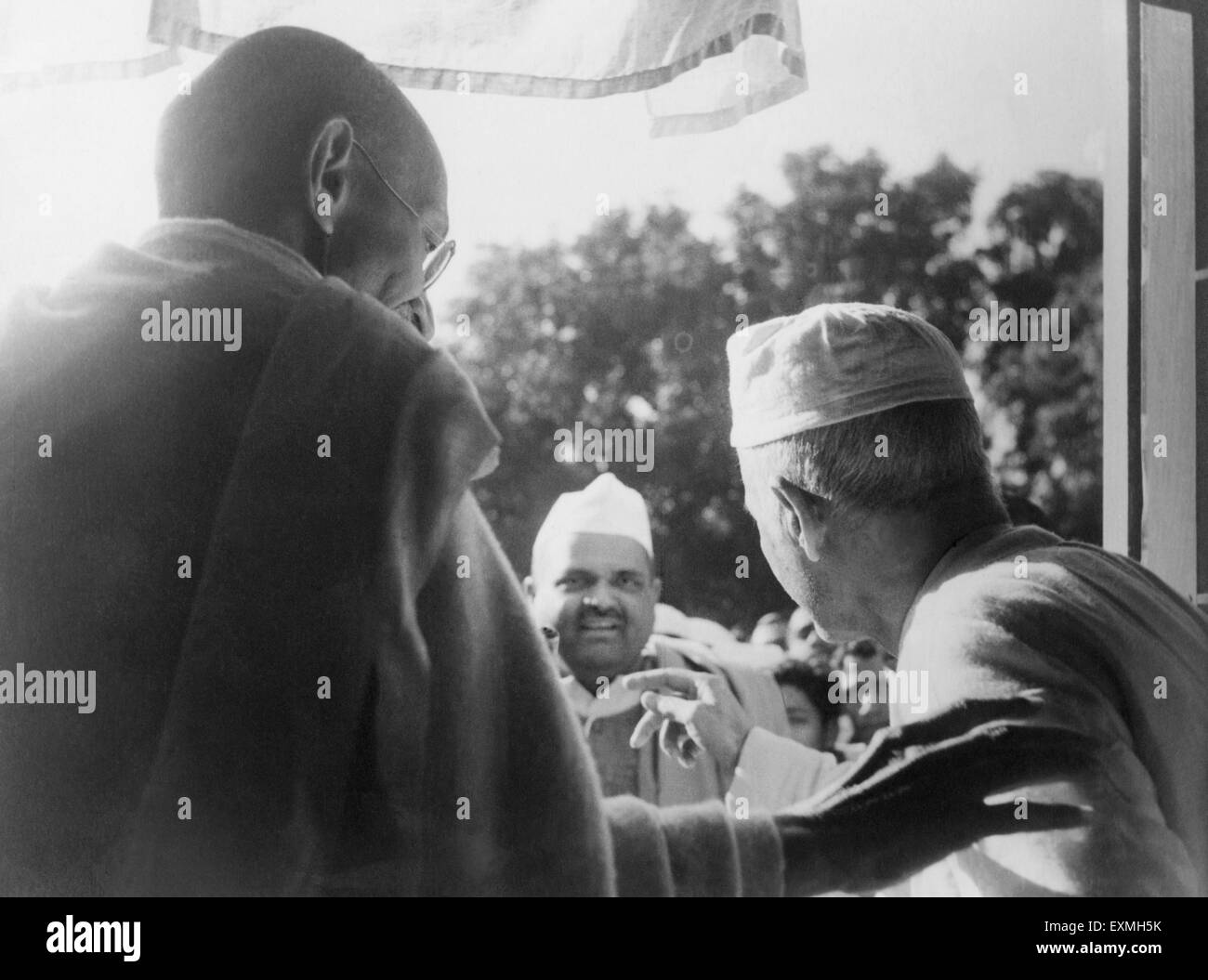 Mahatma Gandhi and Madan Mohan Malaviya looking window watching students procession Benares Hindu University Varanasi Stock Photo