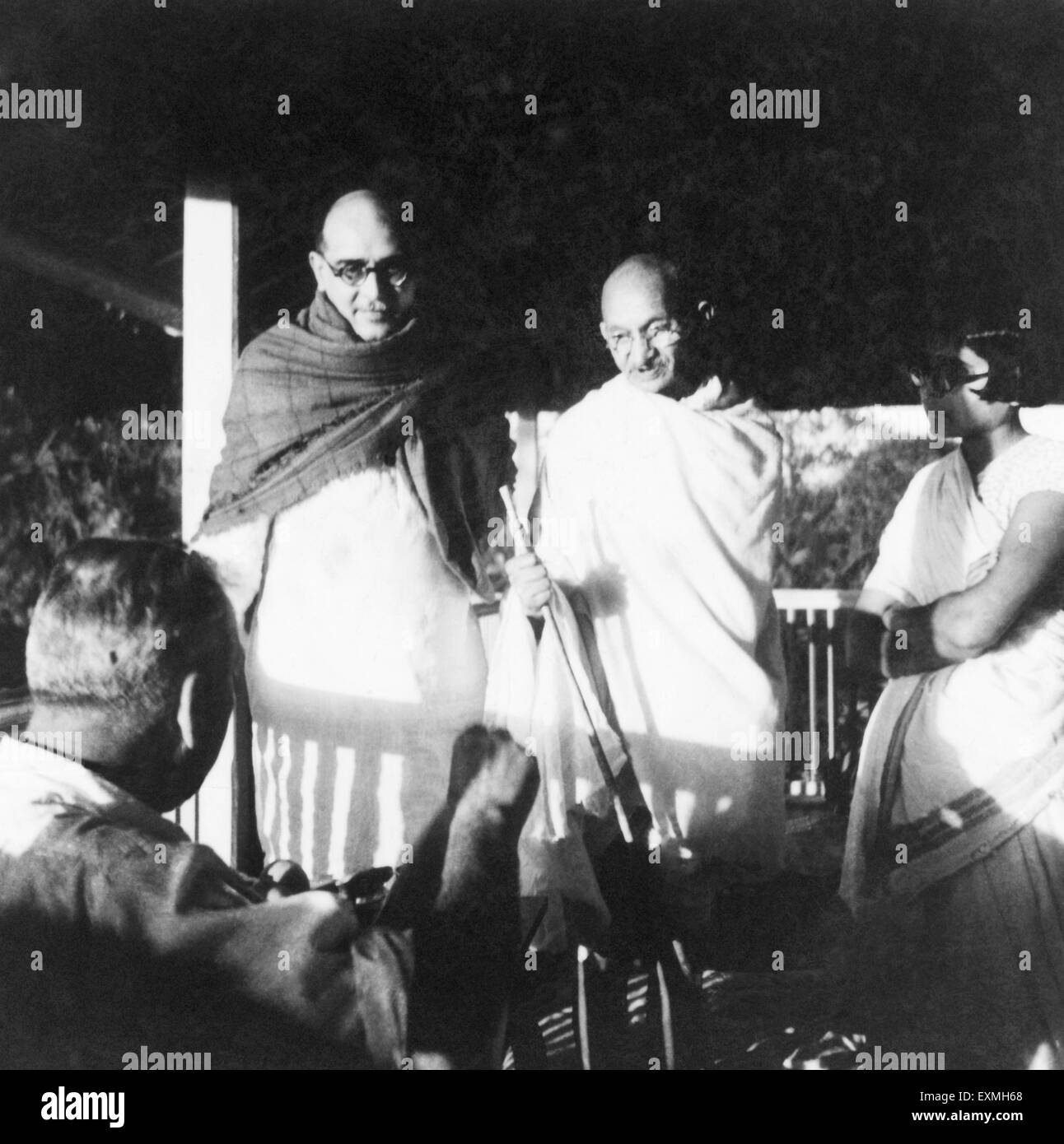 Dr. Hermann Kallenbach ; Mahadev Desai ; Mahatma Gandhi and an ashramite at Bardoli ; 1939 ; India NO MR Stock Photo