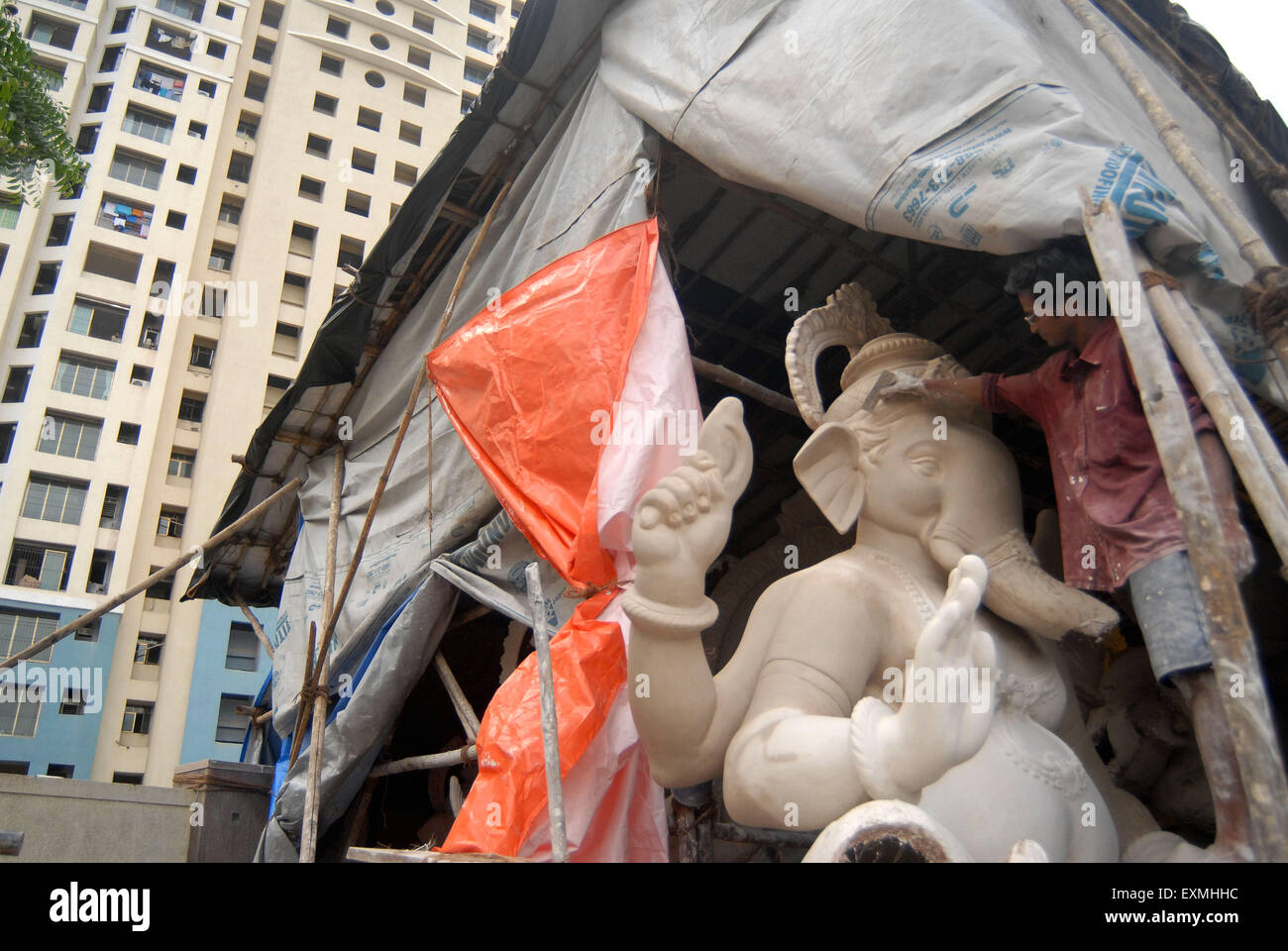 sculptor makes lord Ganesh idols from plaster of Paris in a workshop at Lalbaug for Ganesh ganpati festival Mumbai Stock Photo