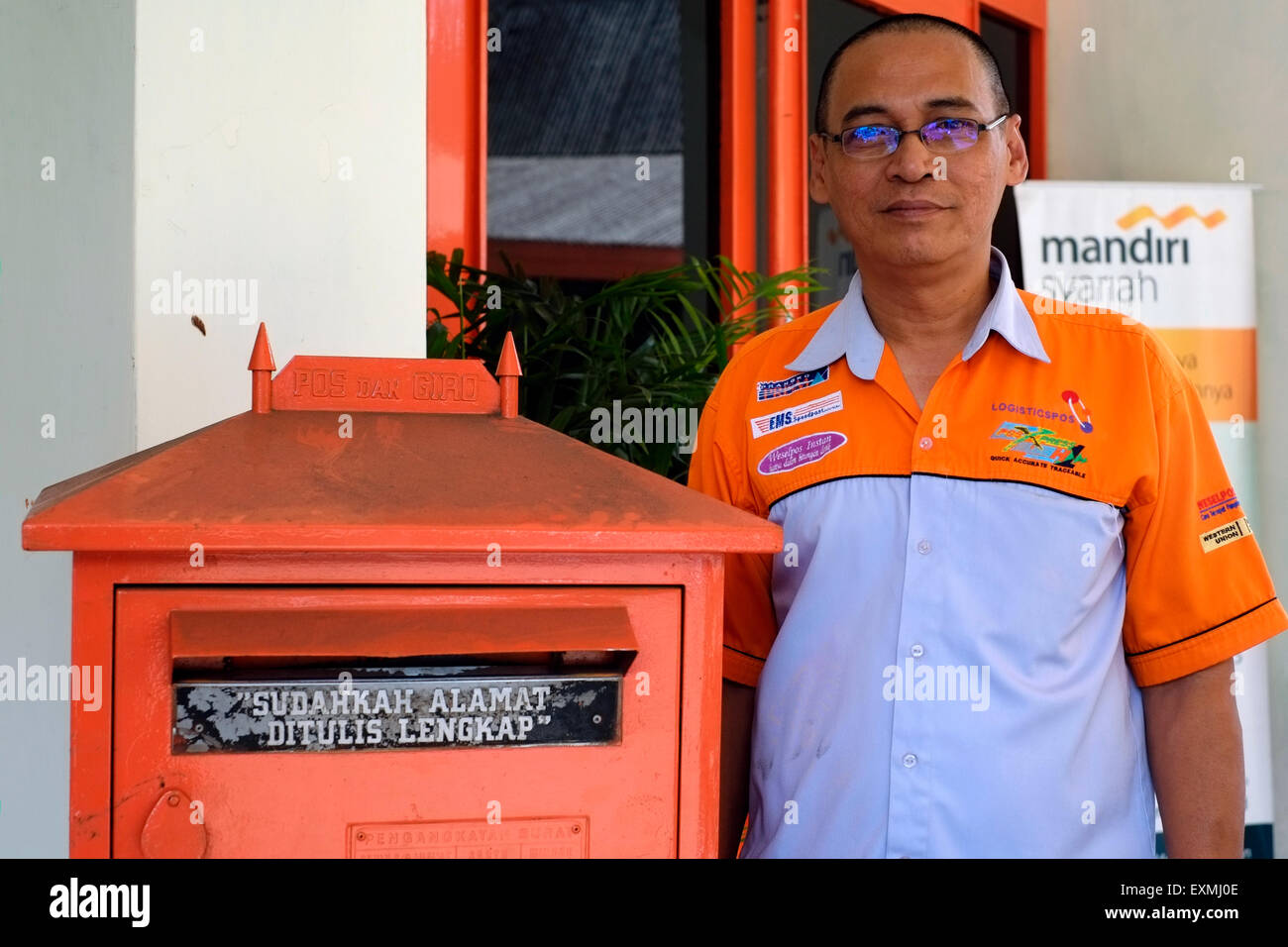 male postal worker at the main post office in malang java indonesia Stock Photo