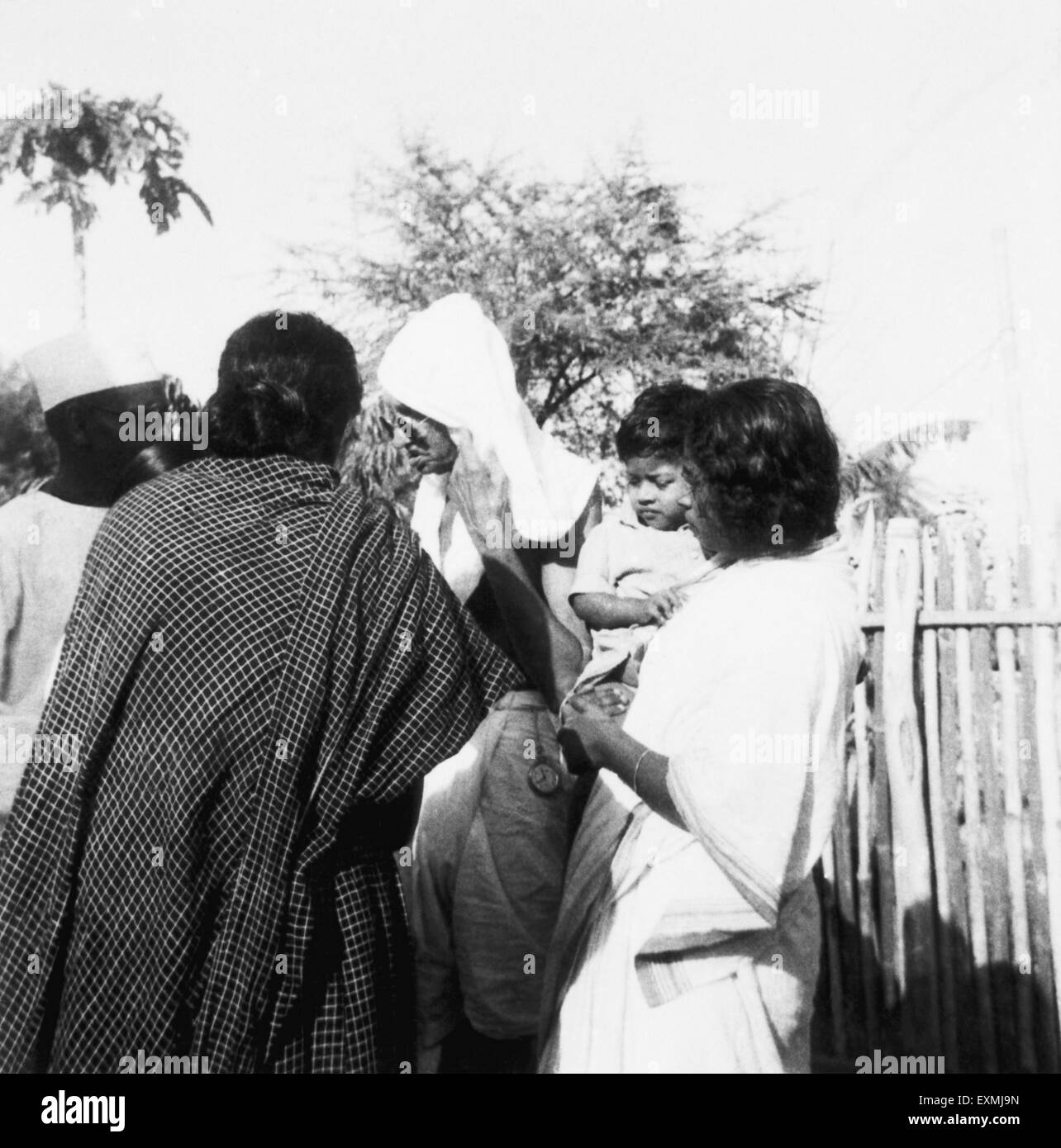Mahatma Gandhi with an ashramite and her relatives at Sevagram Ashram ; 1944 NO MR Stock Photo