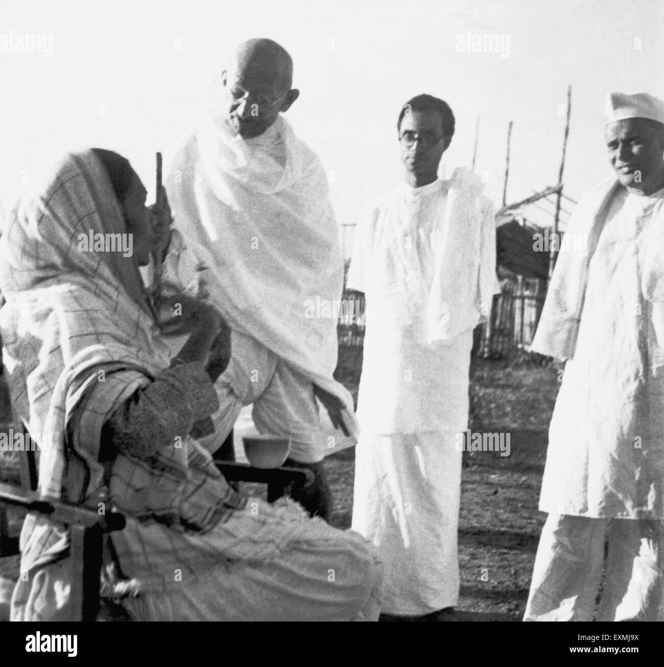 Dr. Das ; Shankaran and Mahatma Gandhi talking with Jankidevi Bajaj at ...