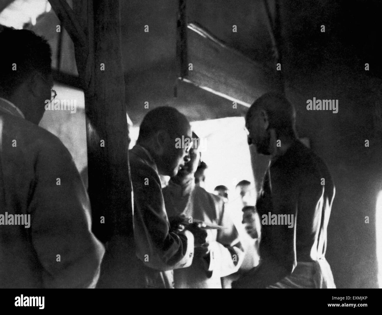 Mahatma Gandhi talking with foreign visitors at Sevagram Ashram ; 1940 NO MR Stock Photo