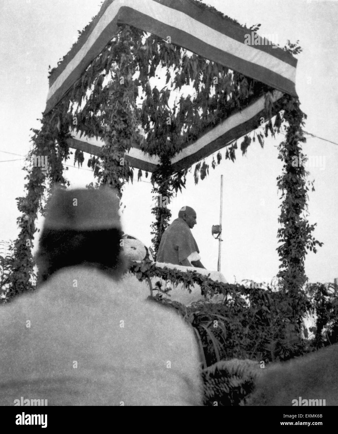 Mahatma Gandhi on dais at a mass meeting in Bengal ; 1945 NO MR Stock Photo