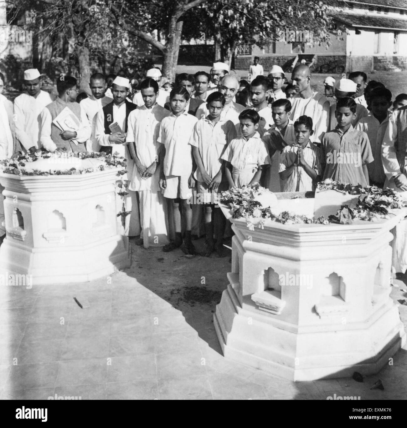 People visiting Mahadev Desai's and Kasturba Gandhi's samadhi's (graveyards ; modernized) at Aga Khan Palace in Pune ; 1944 Stock Photo