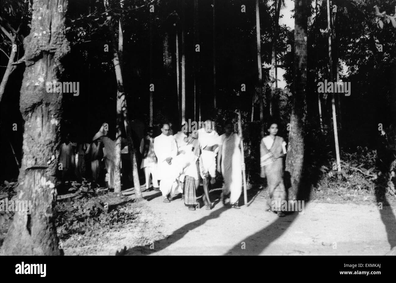 Mahatma Gandhi with Pyarelal Nayar Abha Gandhi Sushila Pai Sushila Nayar march through riot stricken Noakhali East Bengal Stock Photo